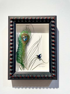 Humming bird -peacock feather colorful still life composition on paper
