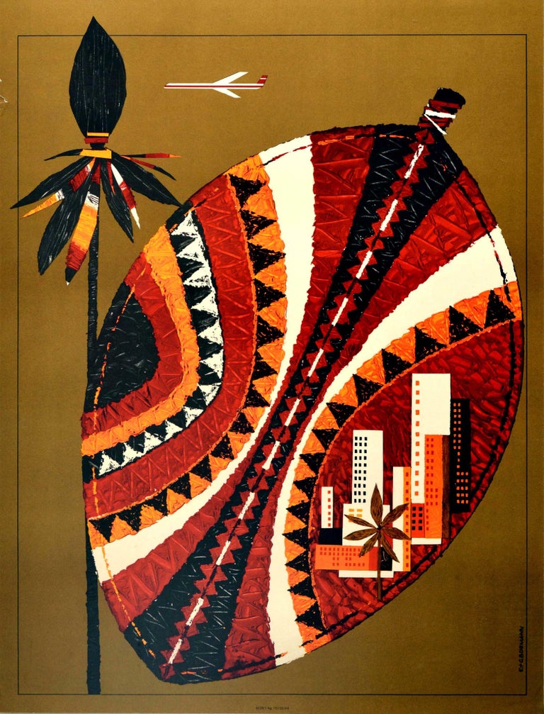 Original vintage aviation advertising poster for Interflug Africa - Fly Interflug German Democratic Republic Airlines - featuring a stylised white and red plane flying over a spear and shield decorated in a traditional colourful pattern with an