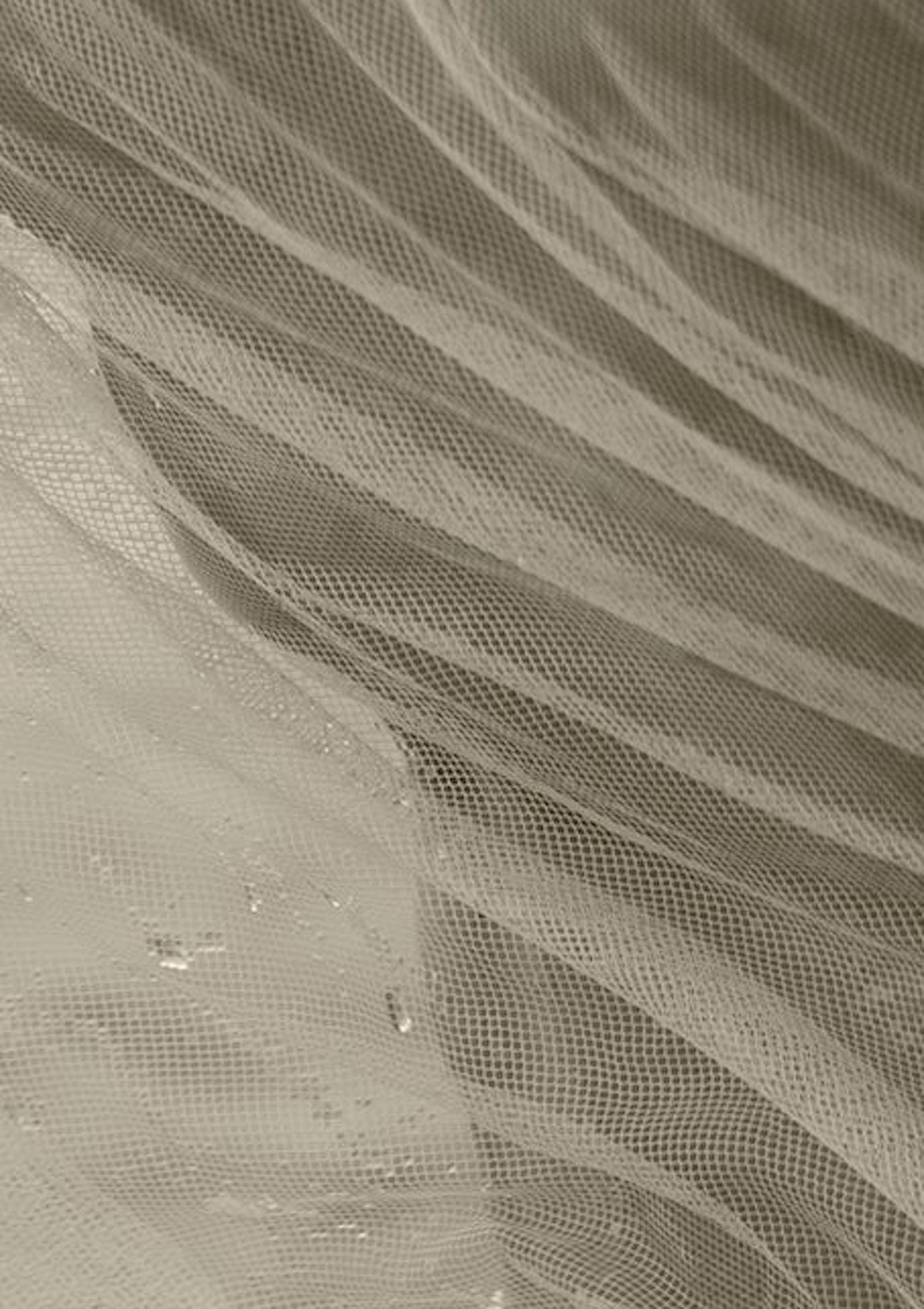 Sepia Photograph
Archival Pigment print
Medium Ed of 10 
For this series, he used elements such as water (emotions) to narrate a story. He worked with the color Blanco in the fabrics to communicate clarity and rebirth.  Cohete,  frequently plays