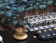 Osadía. Limited edition color photograph of a assembled guitars body sculpture