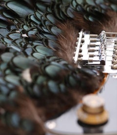 Loca. Limited edition color photograph of a assembled guitars body sculpture