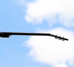 High I. Limited edition color photograph of a assembled guitars body sculpture