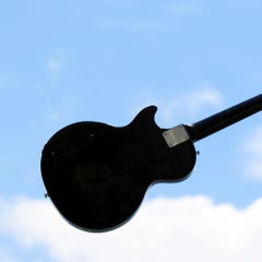 High II. Limited edition color photograph of a assembled guitars body sculpture
