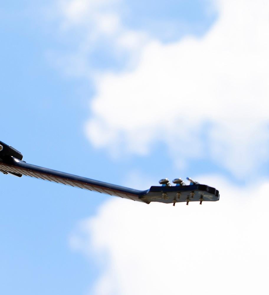 High III. Limited edition color photograph of a assembled guitars body sculpture - Photograph by Kevin Krag