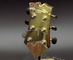 Long live the king. Color photograph of a assembled guitars body Sculpture