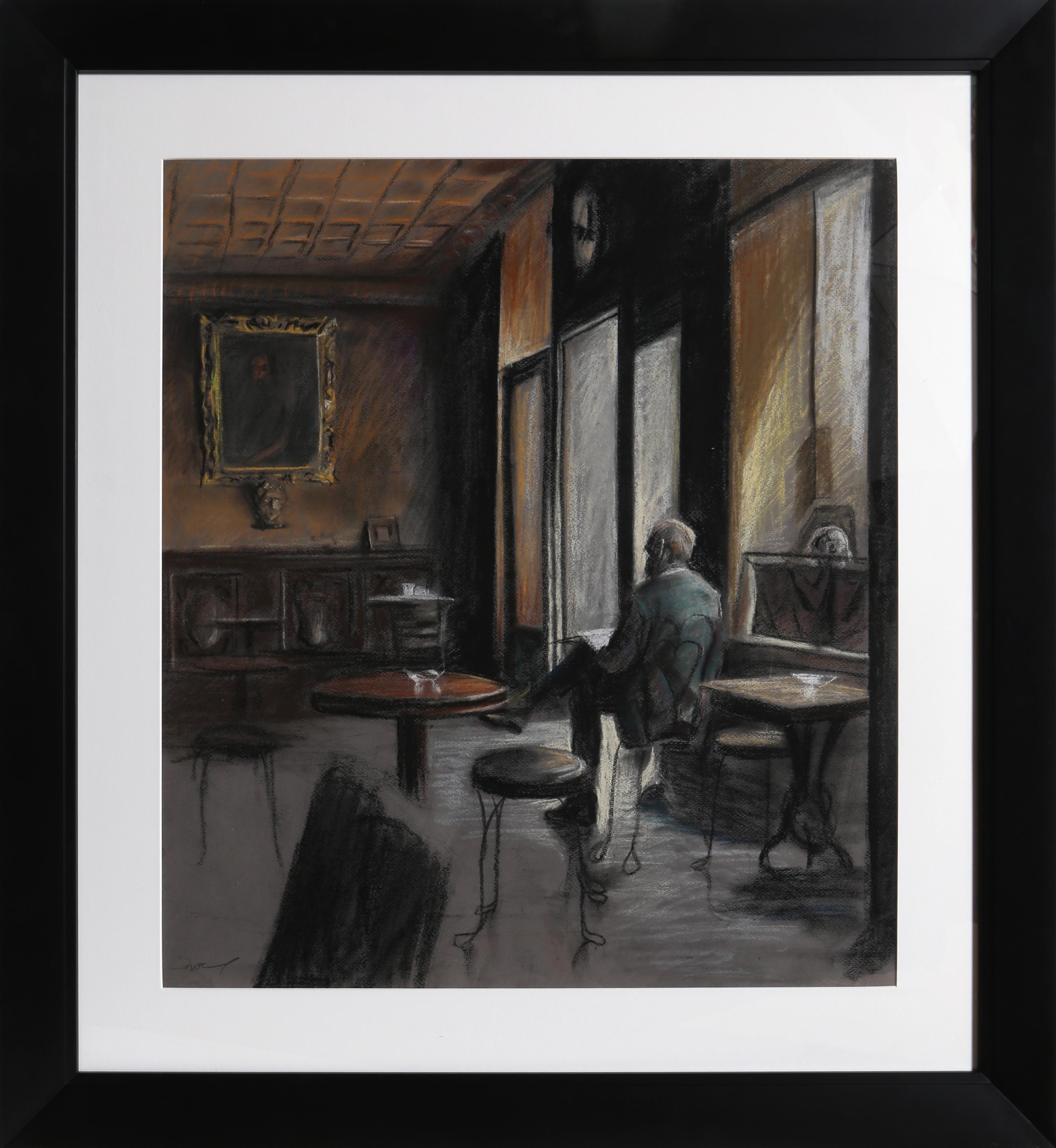 man in a cafe painting
