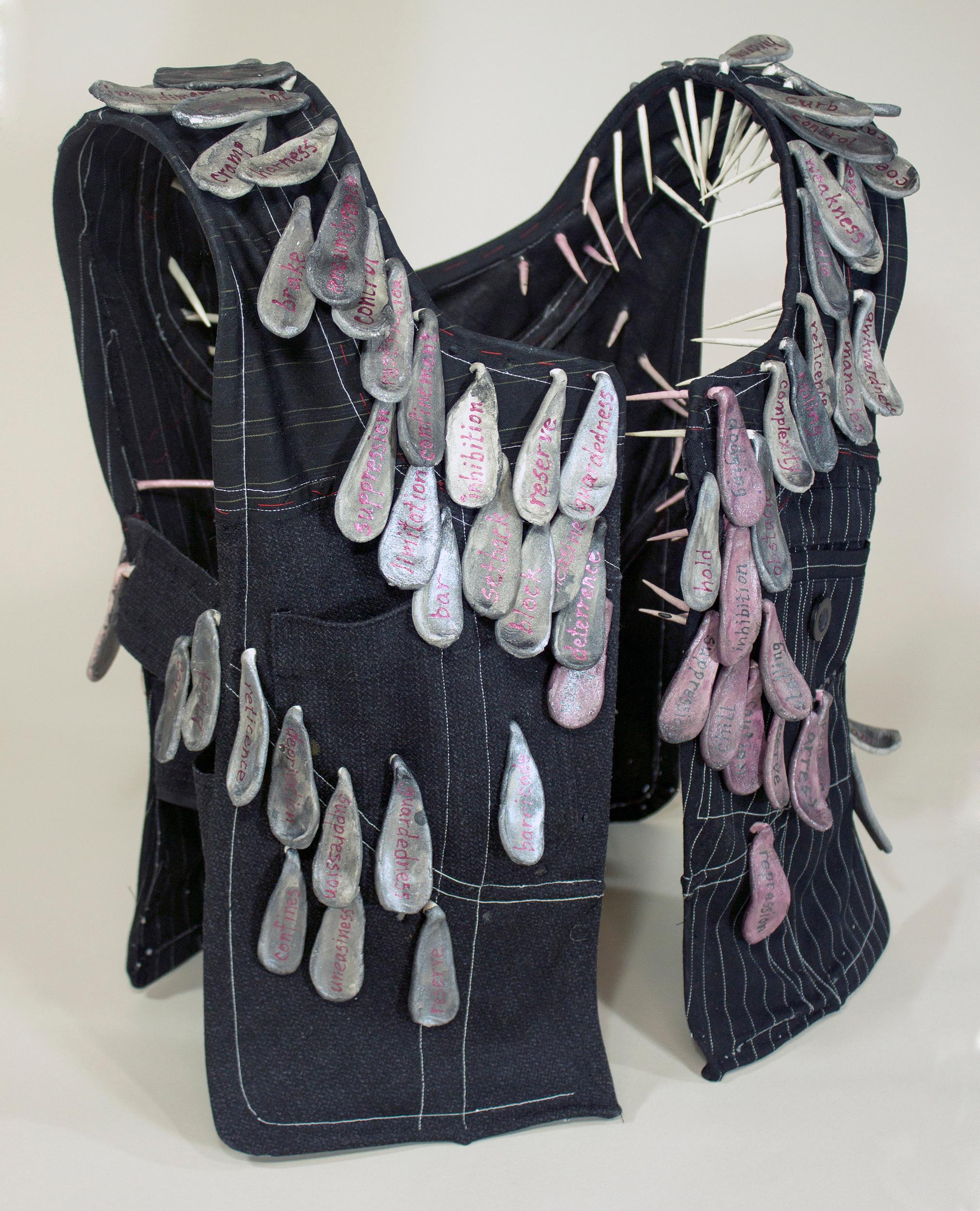 "Restraint", vest, ceramic, black, grey, pink, mixed media, sculpture