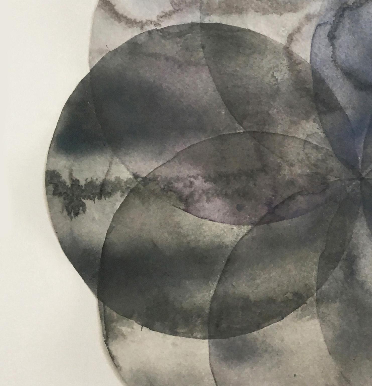 Clare Asch’s “Convergence 10” is part of her series of watercolors consisting of overlapping, transparent circles that explore the interaction of geometry vs. spontaneous paint and gesture. The painting is made up of smoky, silvery greys which