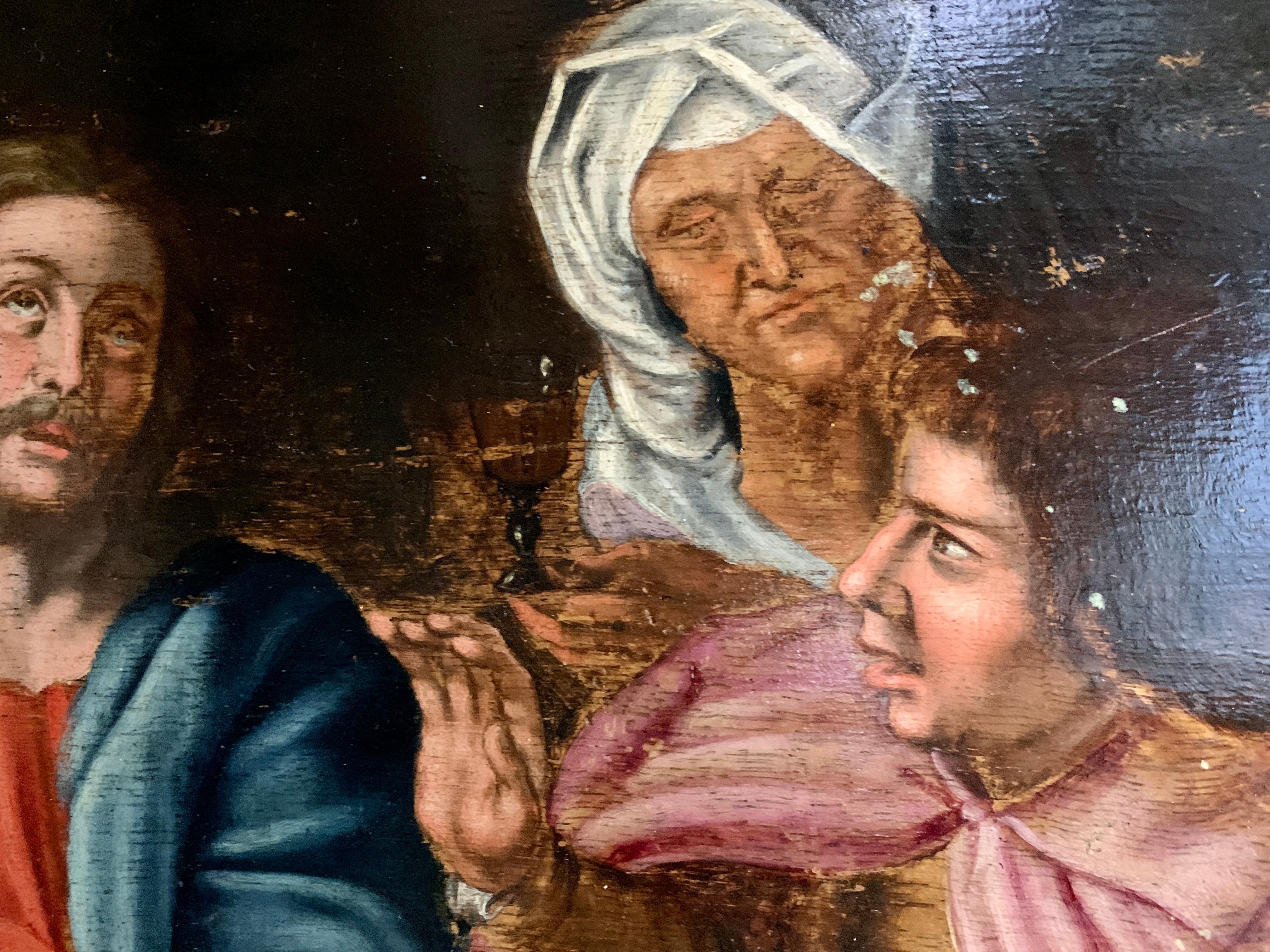 Olio europeo del XVII secolo, Cristo e i suoi discepoli seduti intorno a un tavolo. - Painting di Unknown