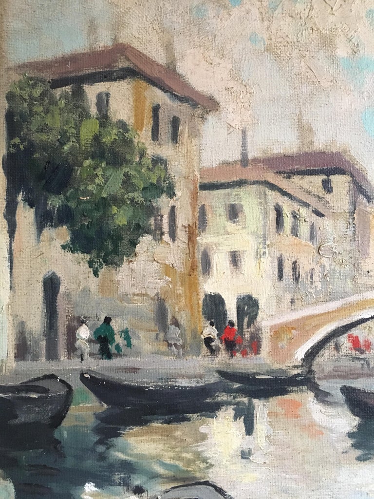 Venice, Landscape Impressionist Oil Painting 
British School, Mid 20th Century
Oil painting on canvas, framed
Framed size: 25 x 22.5 inches

Beautiful portrayal of the streets, and canals of Venice, Italy. The painting shows a boat on the canal,