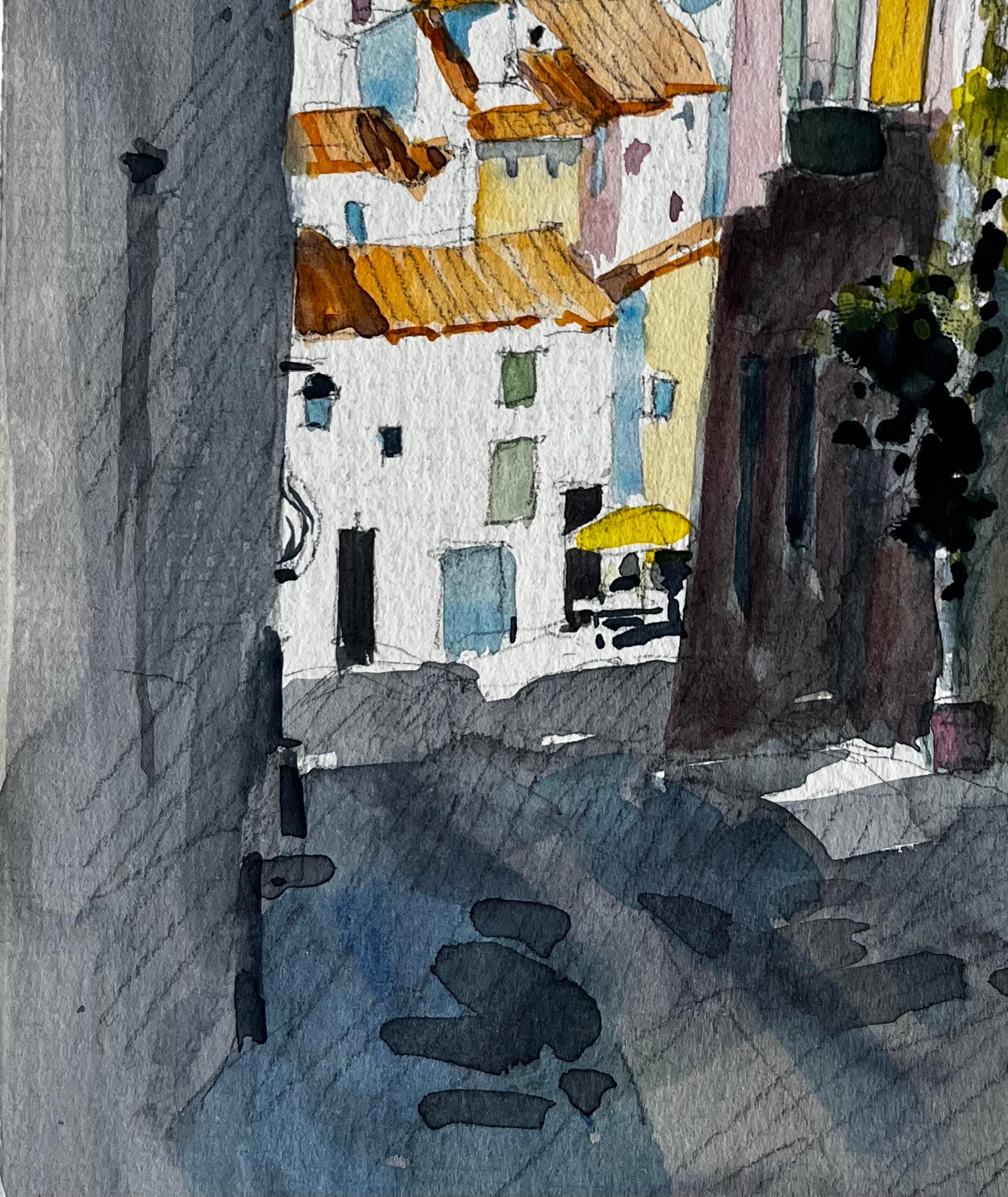 Strada illuminata dal sole a Cucuron con tetti in terracotta e case chiuse Acquerello in vendita 1