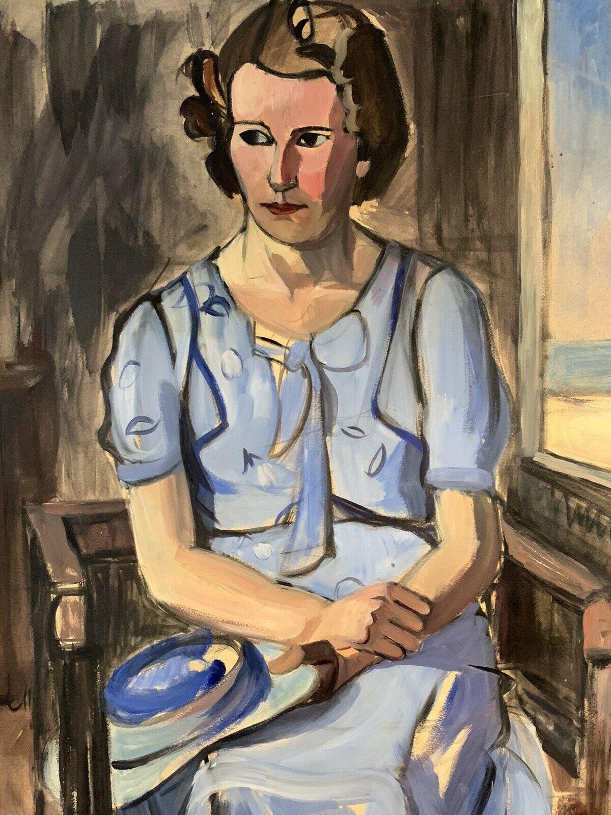 1950's French Oil Young Lady Portrait in Blue Dress with Window out to Beach - Gray Interior Painting by GEORGES JOUBIN (1888-1983)