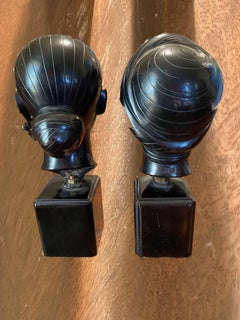 Two bronze busts of girls