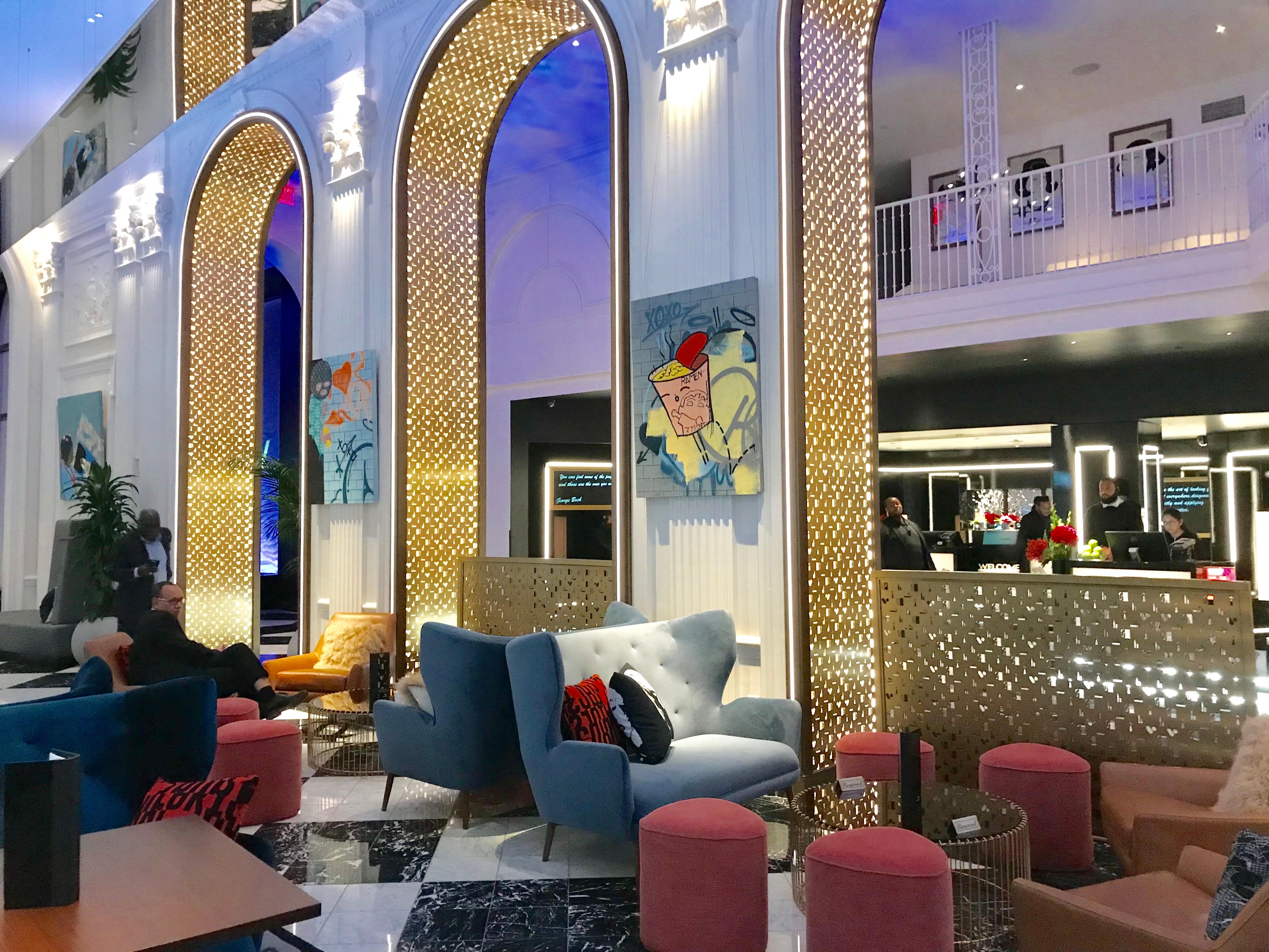 This original one of kind painting dipicts an image of a cup of Ramen on the side of a subway wall with other tags. The artist includes various colors such as yellow, blue, grey, orange, and red. The painting is wired and ready to hang. A