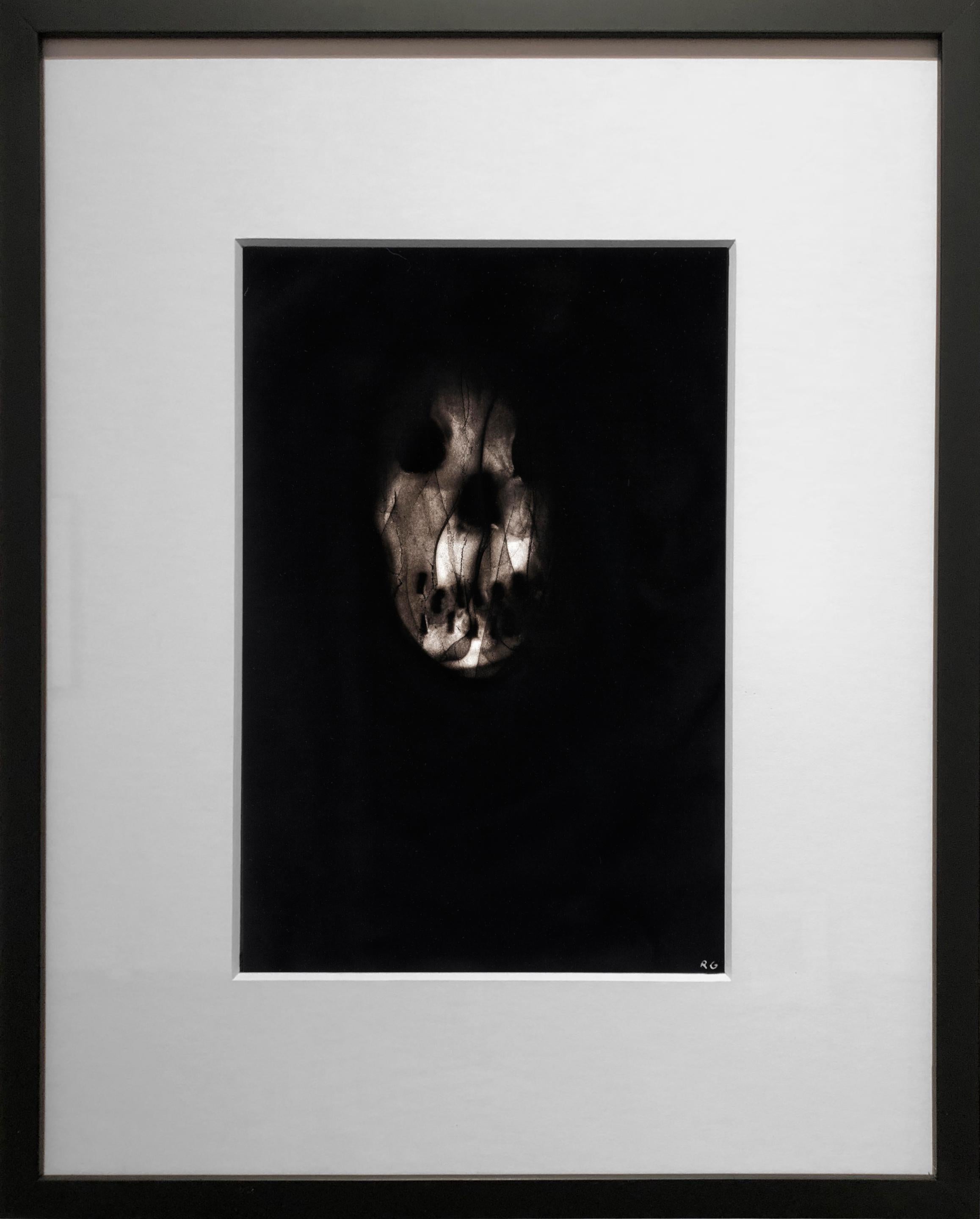 Triptych 3 is a black flame drawing on paper. The artist uses a flame from a torch with precise speed and distance from the paper, which leaves carbon deposits behind in varying degrees of value and rich velvety blacks. The process provides a