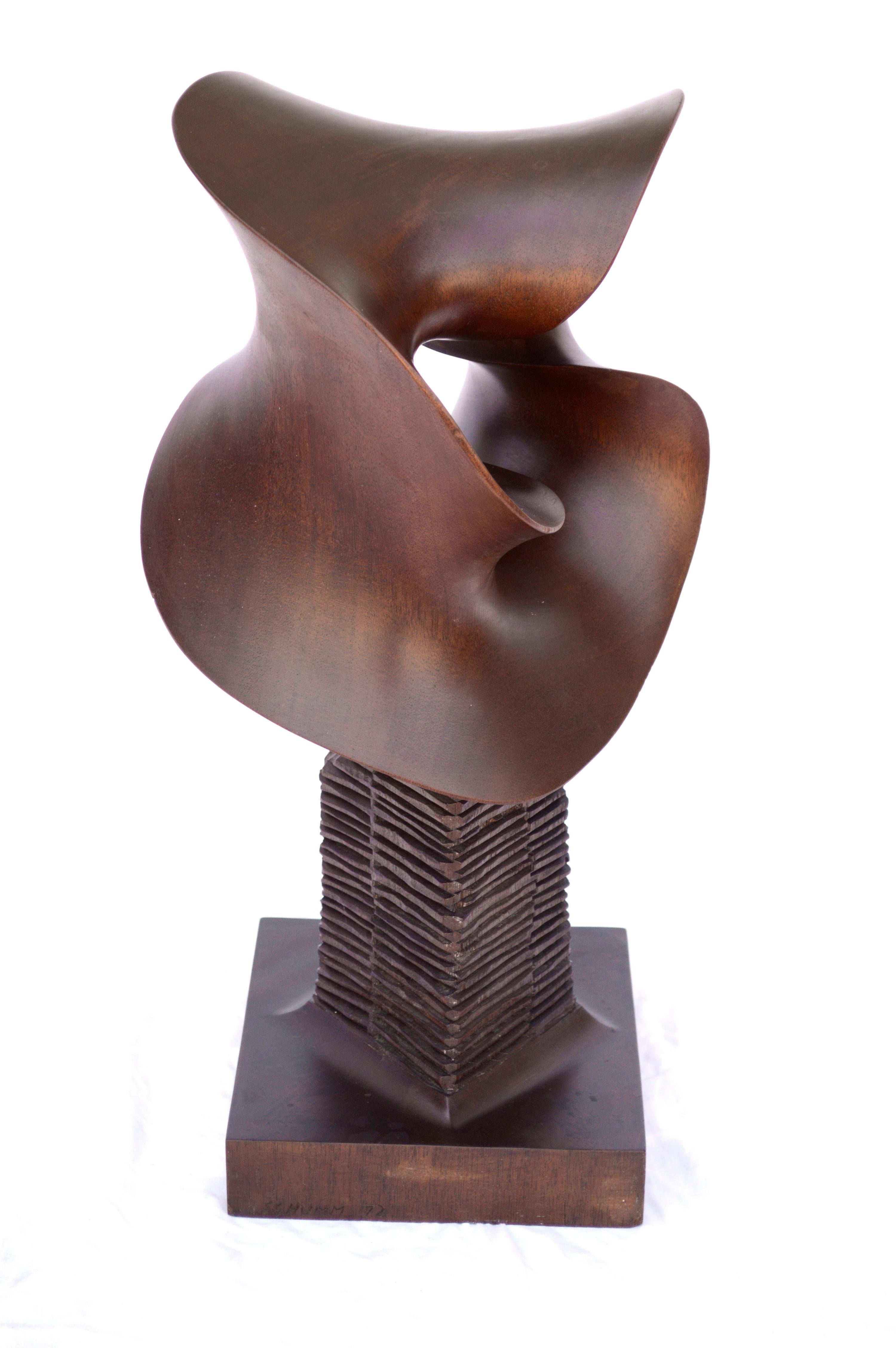 Abstract wood sculpture titled 