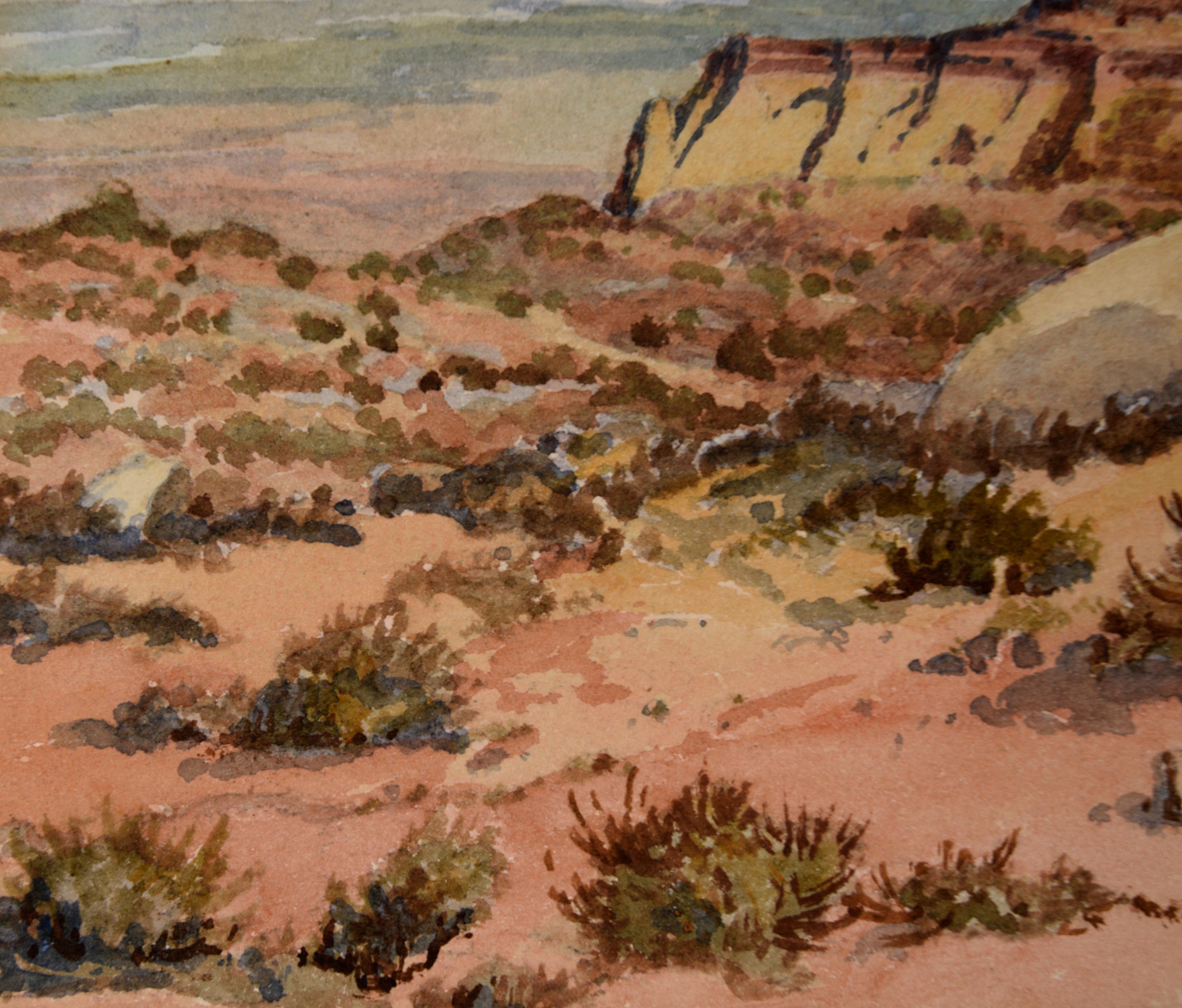 Detailliertes Aquarell des Monument Valley von Albert DeRome (Amerikaner, 1885-1959). Der Betrachter blickt von einem hohen Aussichtspunkt auf das Tal und die hoch aufragenden Tafelberge in der Ferne. Im Vordergrund befinden sich einige Sträucher