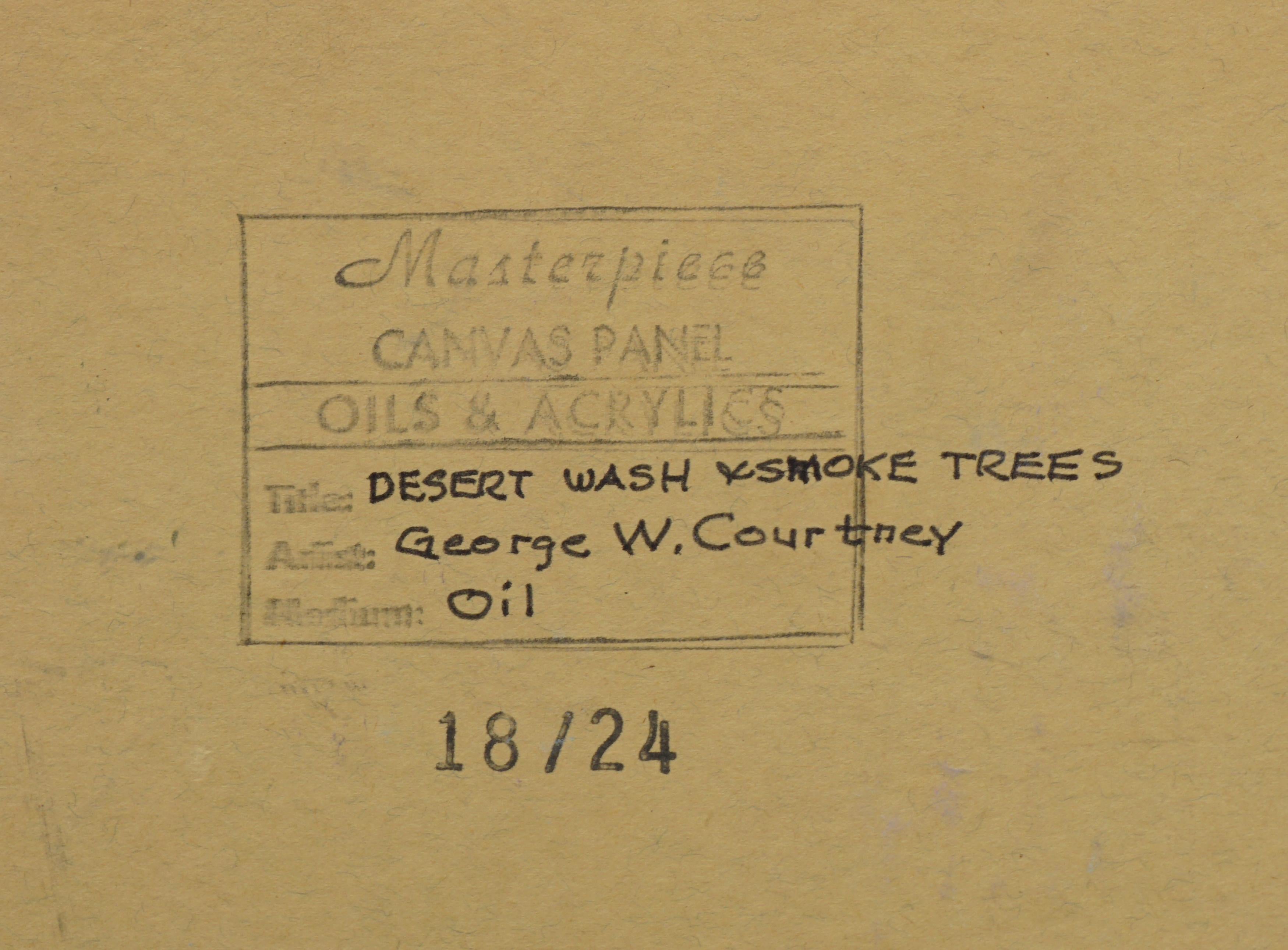 Vivid oil painting of desert wash and smoke trees landscape by George W. Courtney (American, 20th Century), circa 1970. California artist whom exhibited during the 1960-1970s era. Signed lower right corner and on verso. Unframed, oil on artists