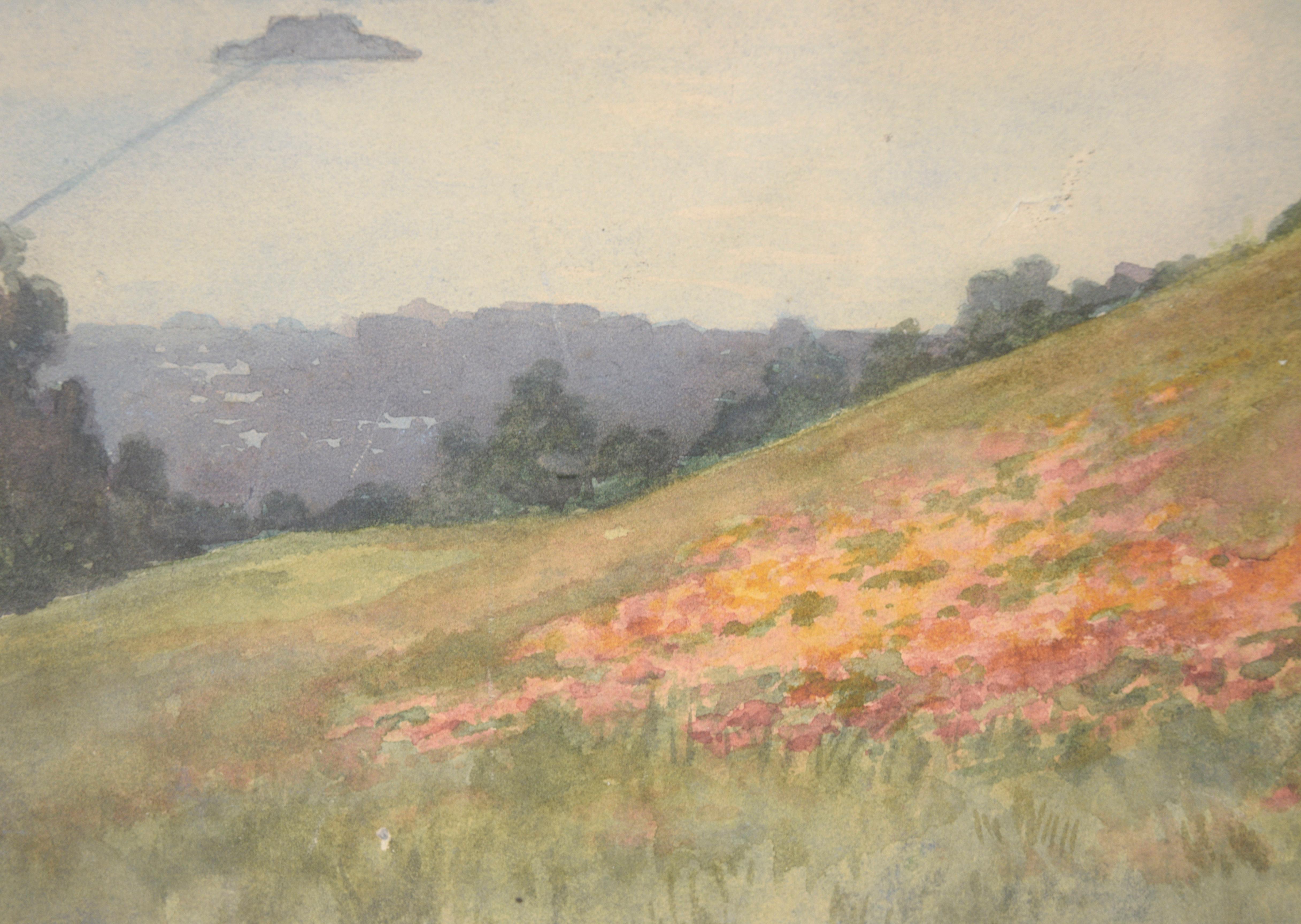 Serene watercolor by an unknown artist (20th Century), in the style of Elmer Wachtel (American, 1864 - 1929). This mid-century landscape watercolor shows a beautiful sweeping view of the coast, with a grassy hillside dotted with wildflowers in the