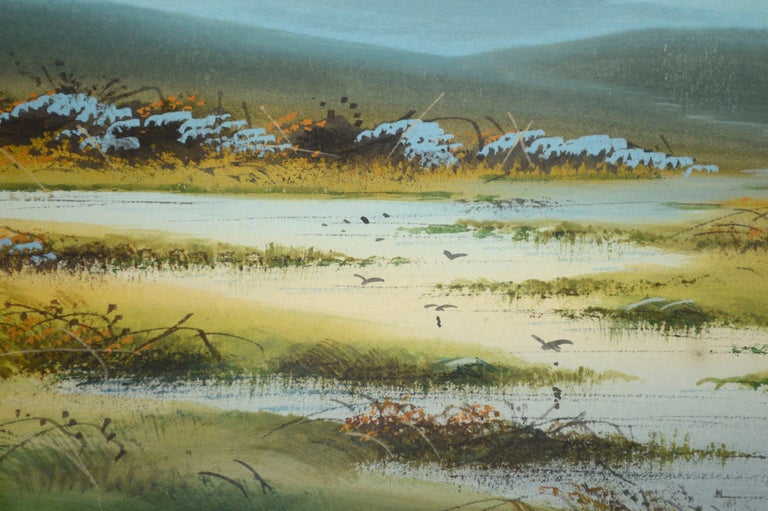 Serene 1920's watercolor landscape of calm water snaking through a lush marshy wetland, dotted with small birds, wildflowers and swaying grass, by an unknown artist (American, 20th Century). Newspaper fixed to verso of original mat is dated 1921.