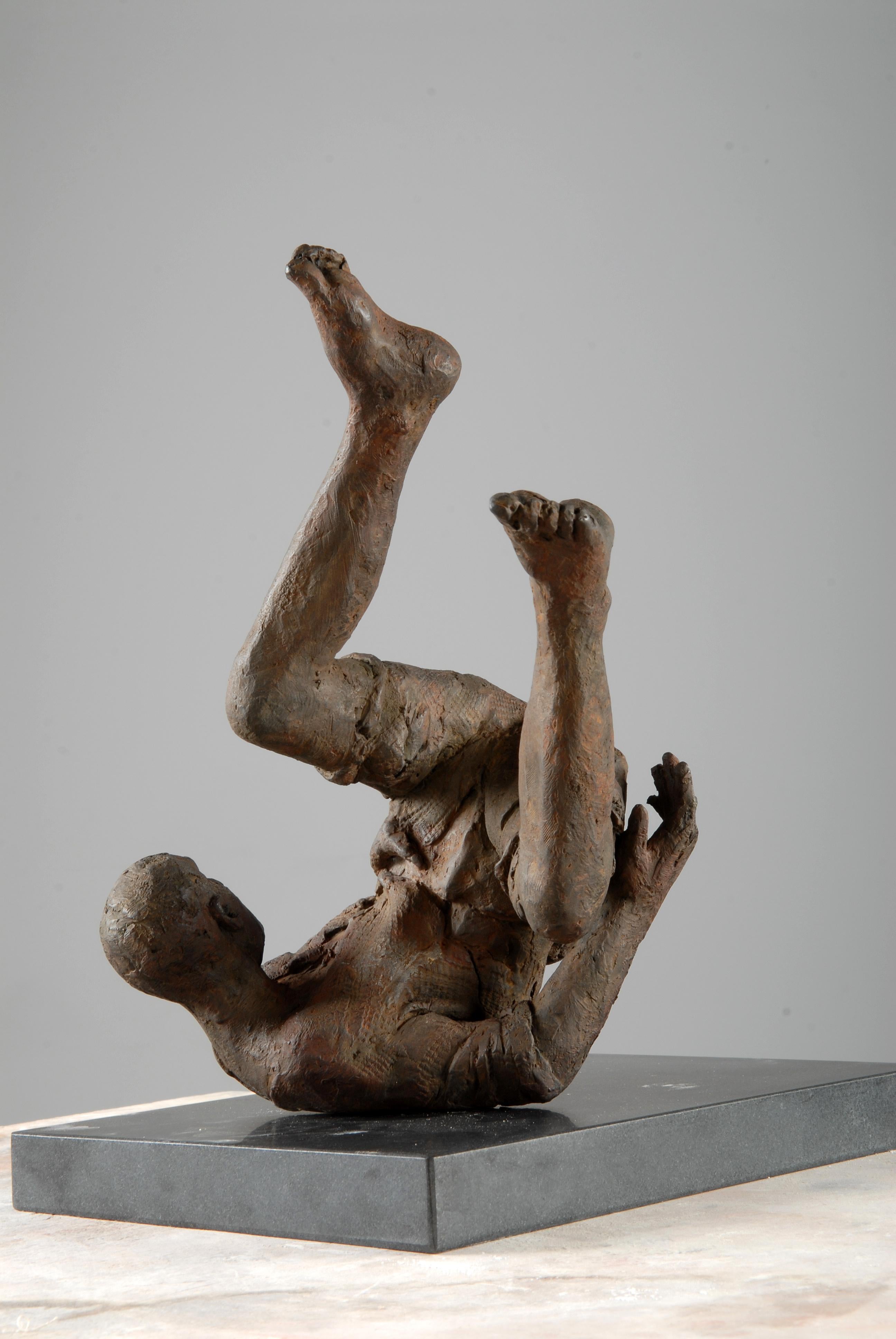 tumbling woman statue