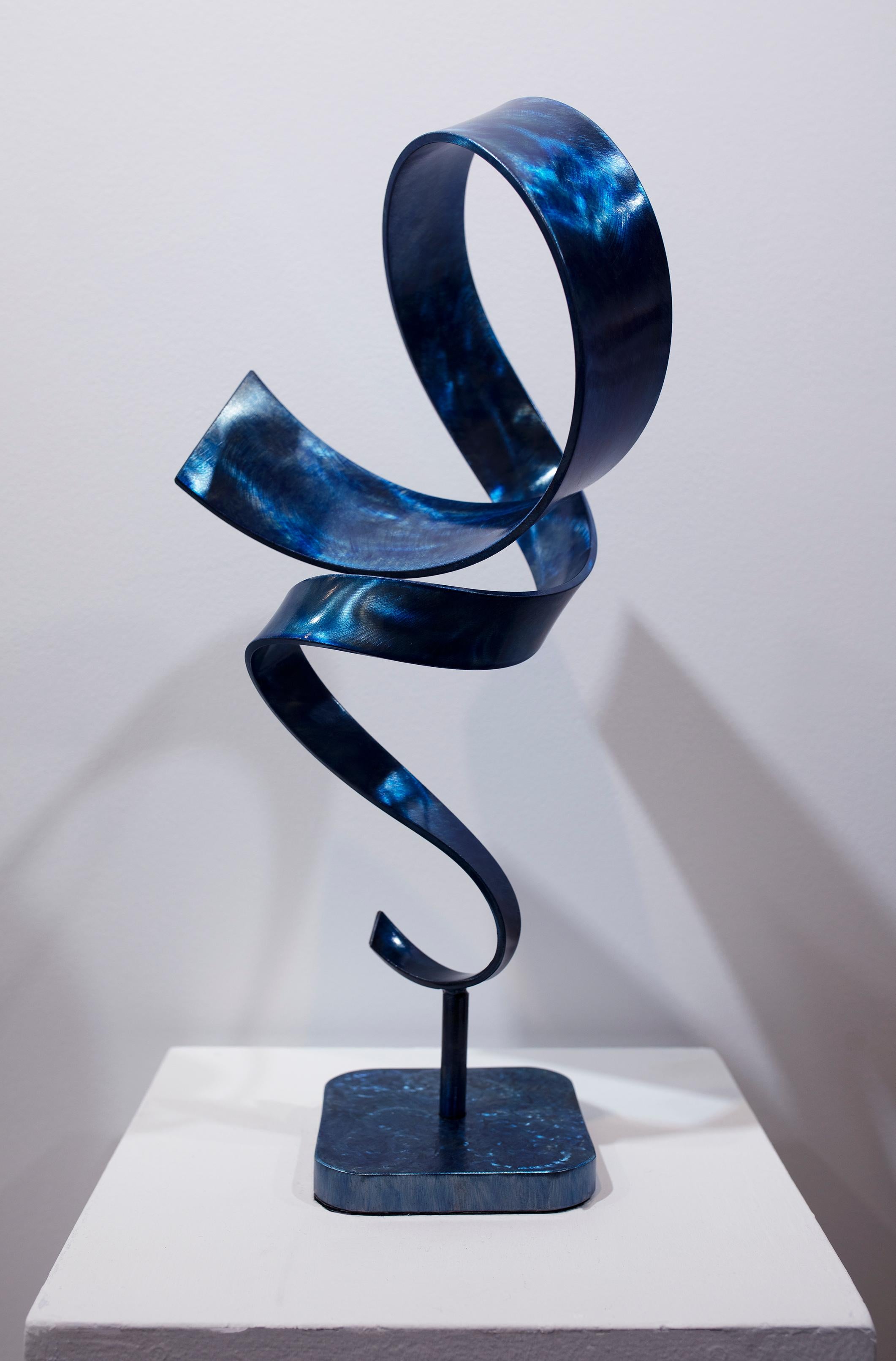 Blue Windup is a tabletop sculpture made out of steel with a blue dye and clear coat. 

Connecticut sculptor Joe Sorge says about his work, 
