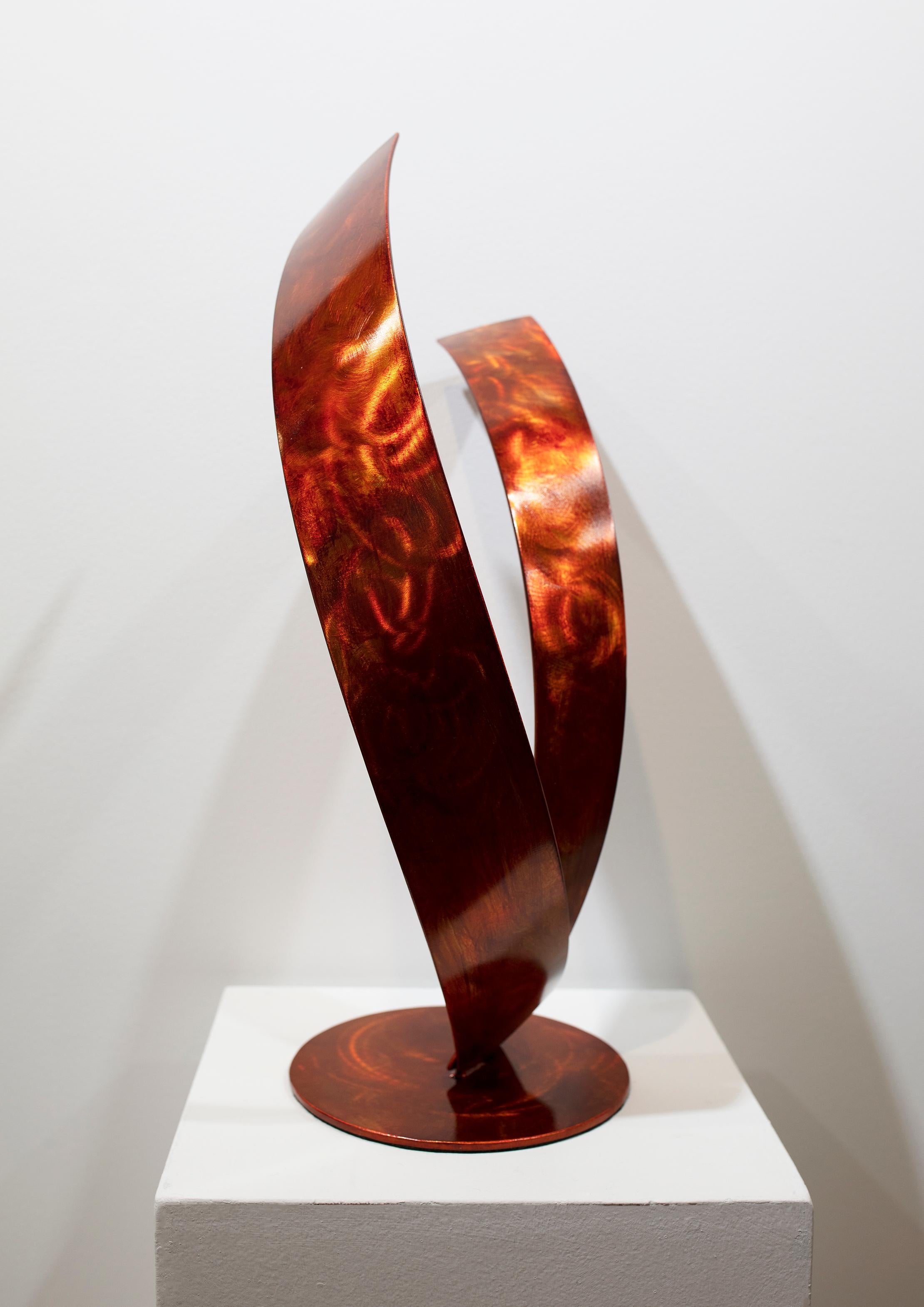 Orange Wave is a tabletop sculpture made out of stainless steel with an orange dye and clear coat. 

Connecticut sculptor Joe Sorge says about his work, 