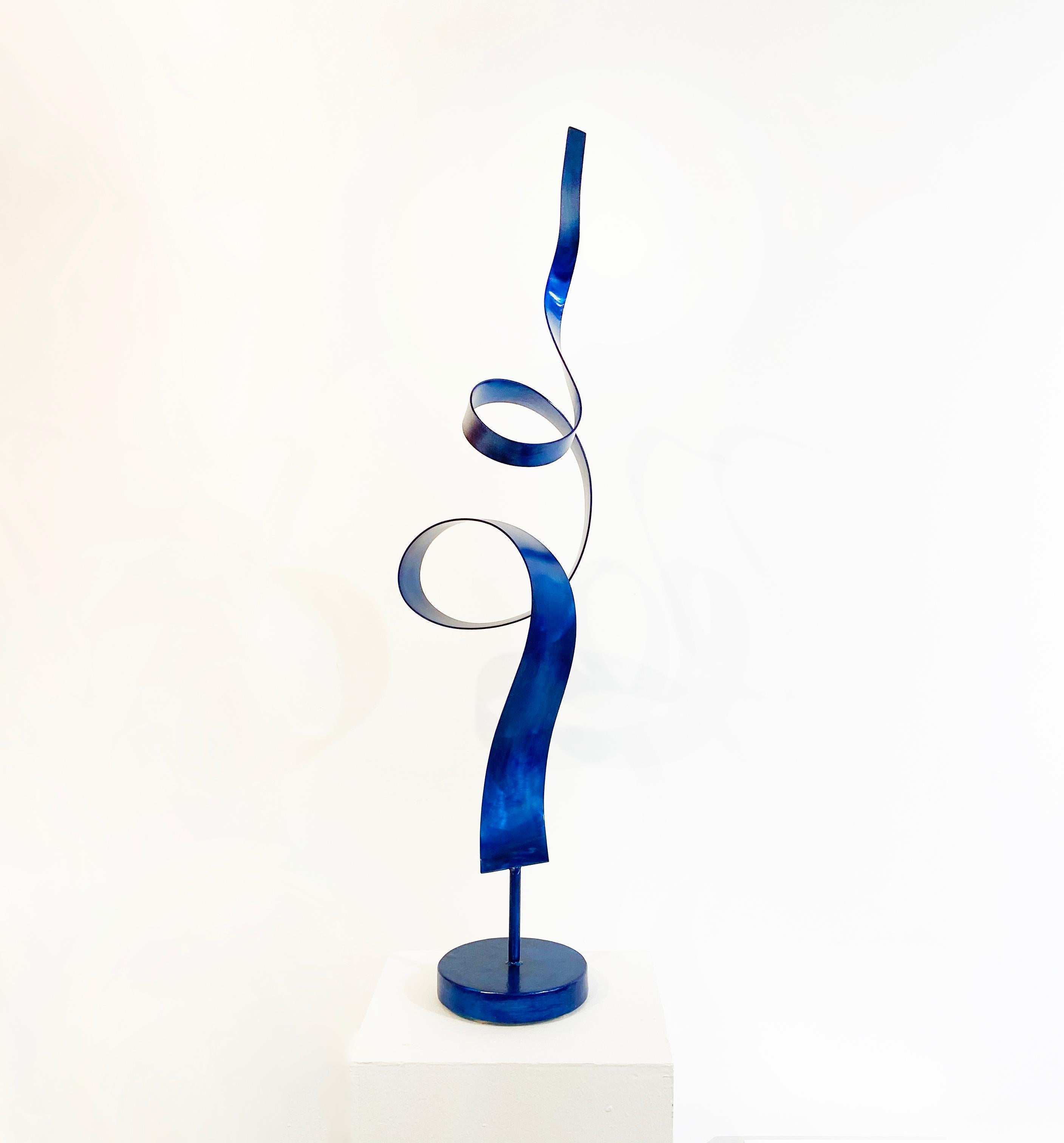 'Ribbon Dance in Blue' is a tabletop sculpture made out of steel with a blue dye and clear coat. 

Connecticut sculptor Joe Sorge says about his work, 