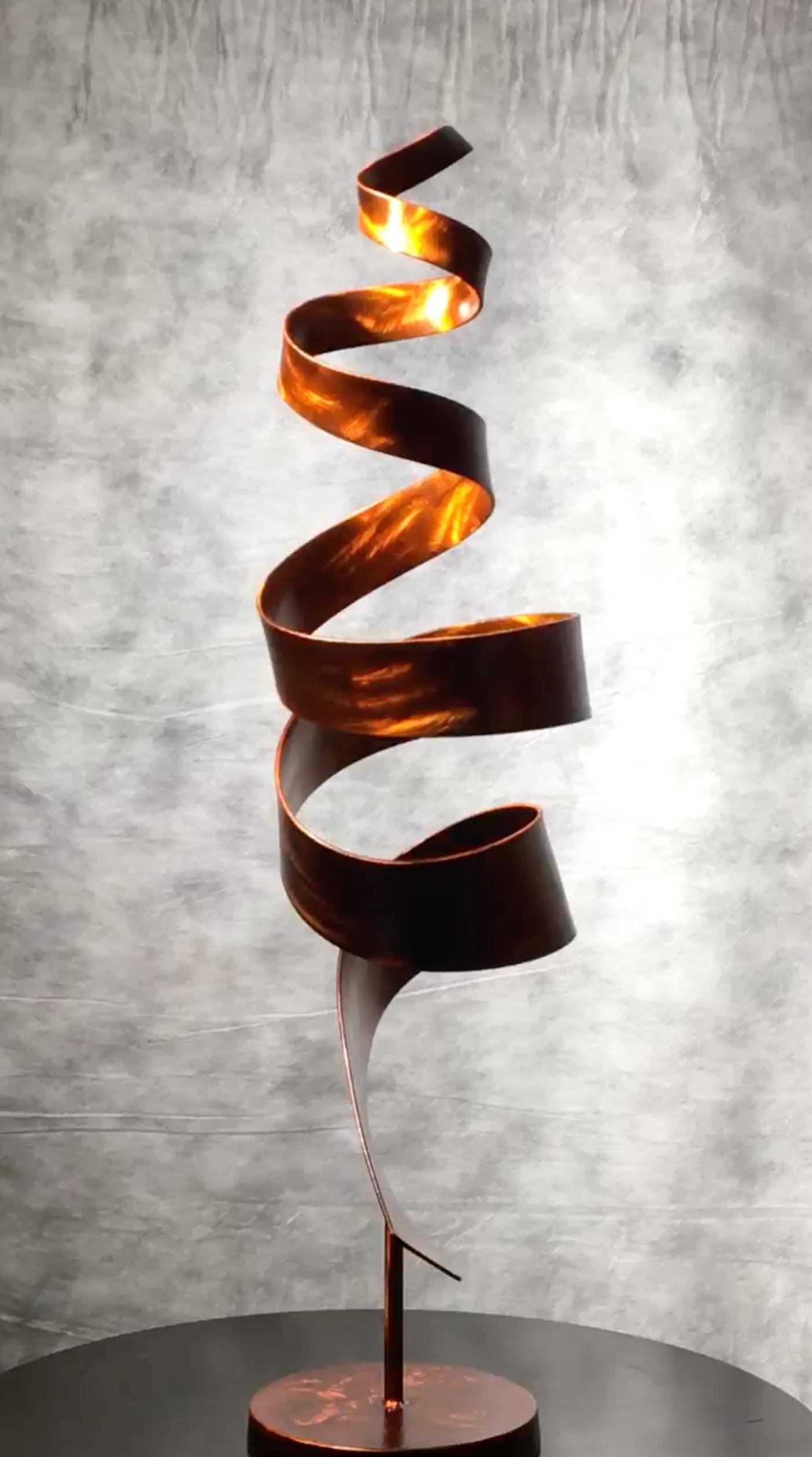 Orange Skyline is an abstract sculpture by Joe Sorge, made from stainless steel with an orange dye and clear coat. The white pedestal pictured beneath the sculpture base is not included. 

Connecticut sculptor Joe Sorge says about his work, 
