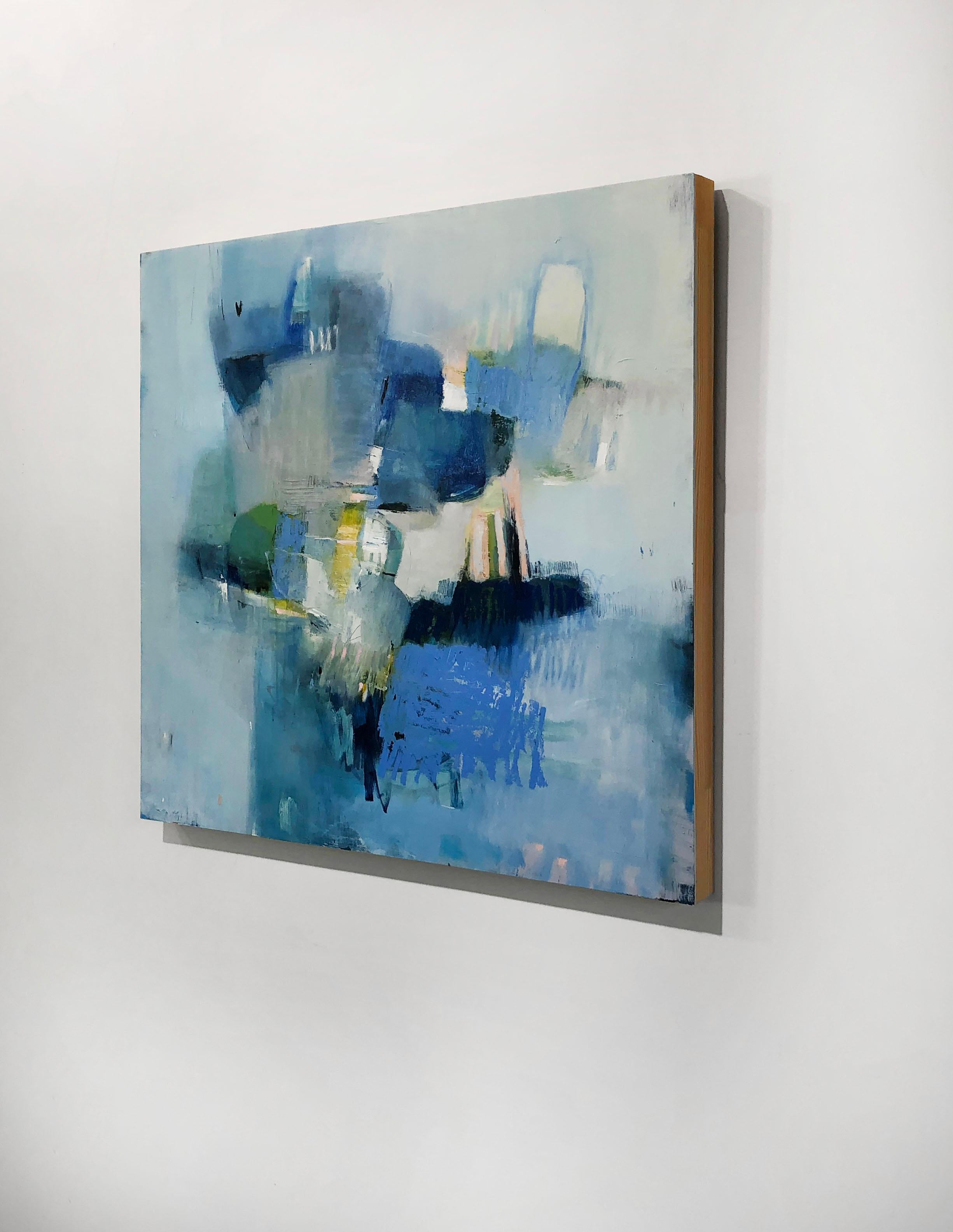 This abstract oil painting by Kelly Rossetti features a central cluster of blocks of cool colors, with pink, yellow, and green abstracts throughout. Lighter colors of paint are layered around the border of the canvas, giving the central assembly of