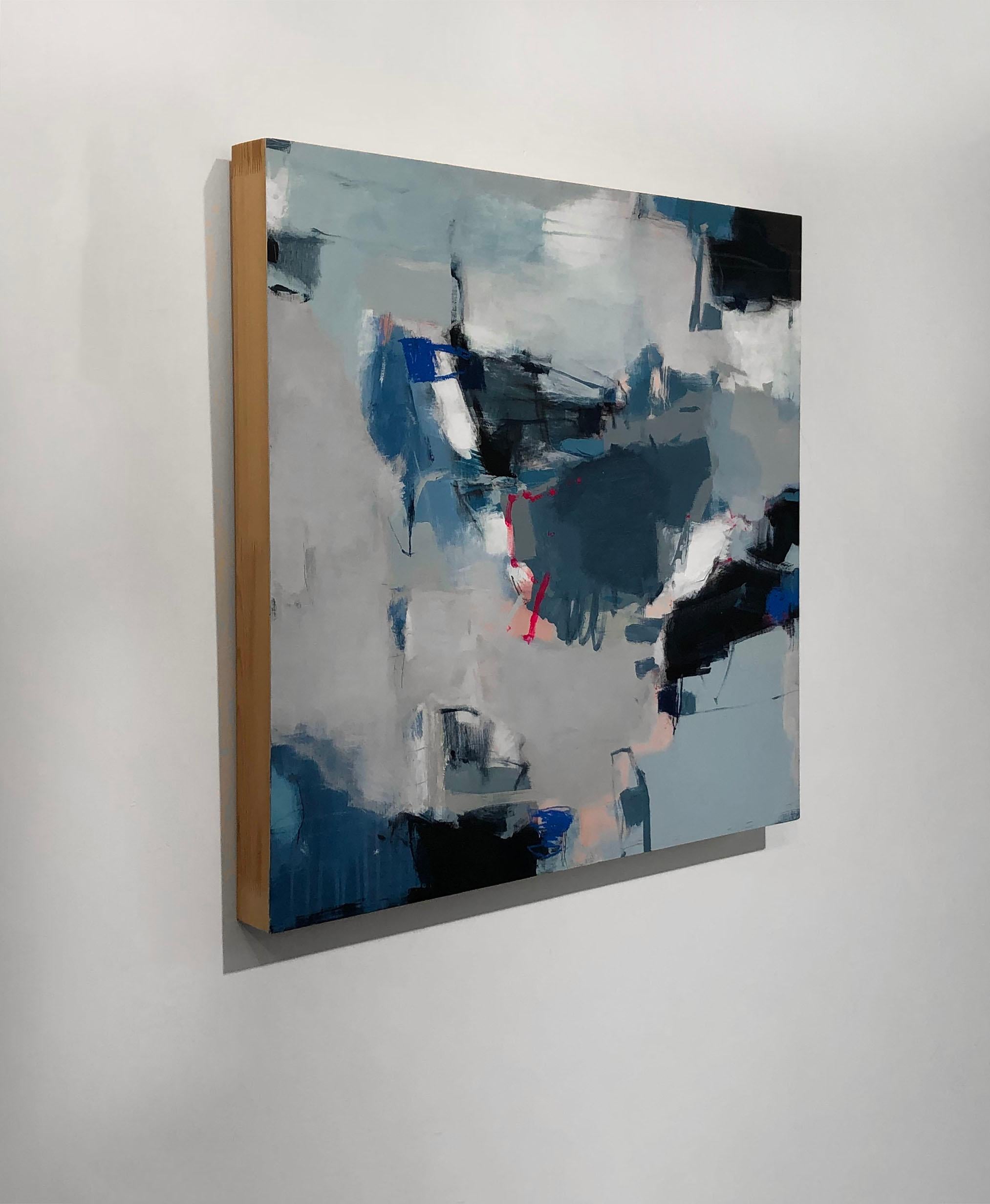This moderately-sized abstract painting by Kelly Rossetti is made with mixed media on panel. Strokes of different shades and hues of blue are layered overtop of one another in this contemporary piece, with larger areas of black throughout. At the