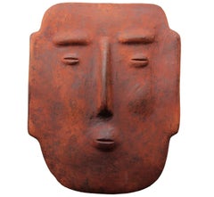 Sculpture murale masque en terre cuite