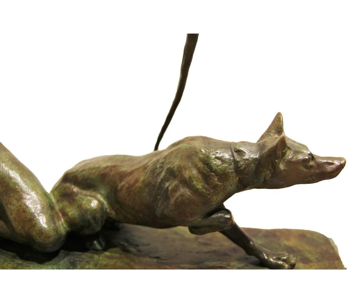 Figurative bronze sculpture of a man with his dog hunting. The man has a drawn bow. The sculpture is mounted on a marble base. The signature is stamped on to the bronze. 

Artist Biography: 
Louis Riché first exhibited at the Salon in Paris in 1896