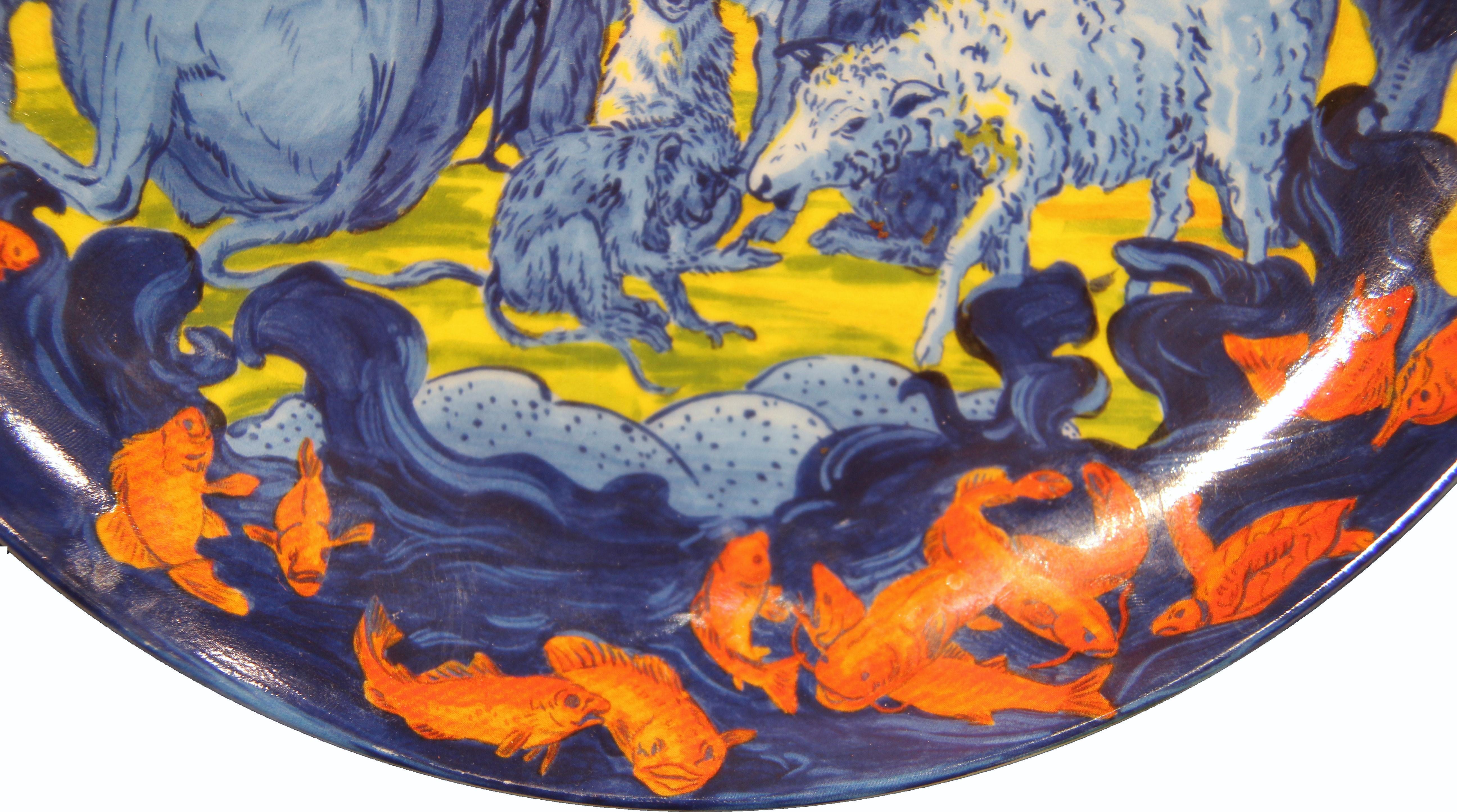Limited edition artist plate printed for the Blaffer Gallery at the University of Houston by Swid Powell. The plate features different animals including lions, deer, bears, and birds along with koi fish framing the bottom of the plate. The piece is