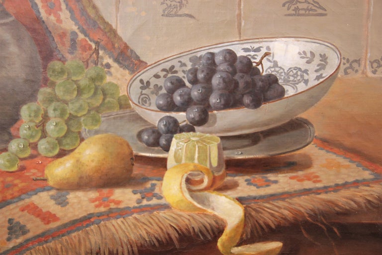 Classical still life painting of a metal water jug, a collection of various fruits, and an ornate tapestry beautifully executed in the Dutch school style. Signed by the artist in the lower left corner. Currently framed in a complimentary gold and