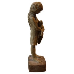 Naturalistic Woman Holding a Calf Sculpture