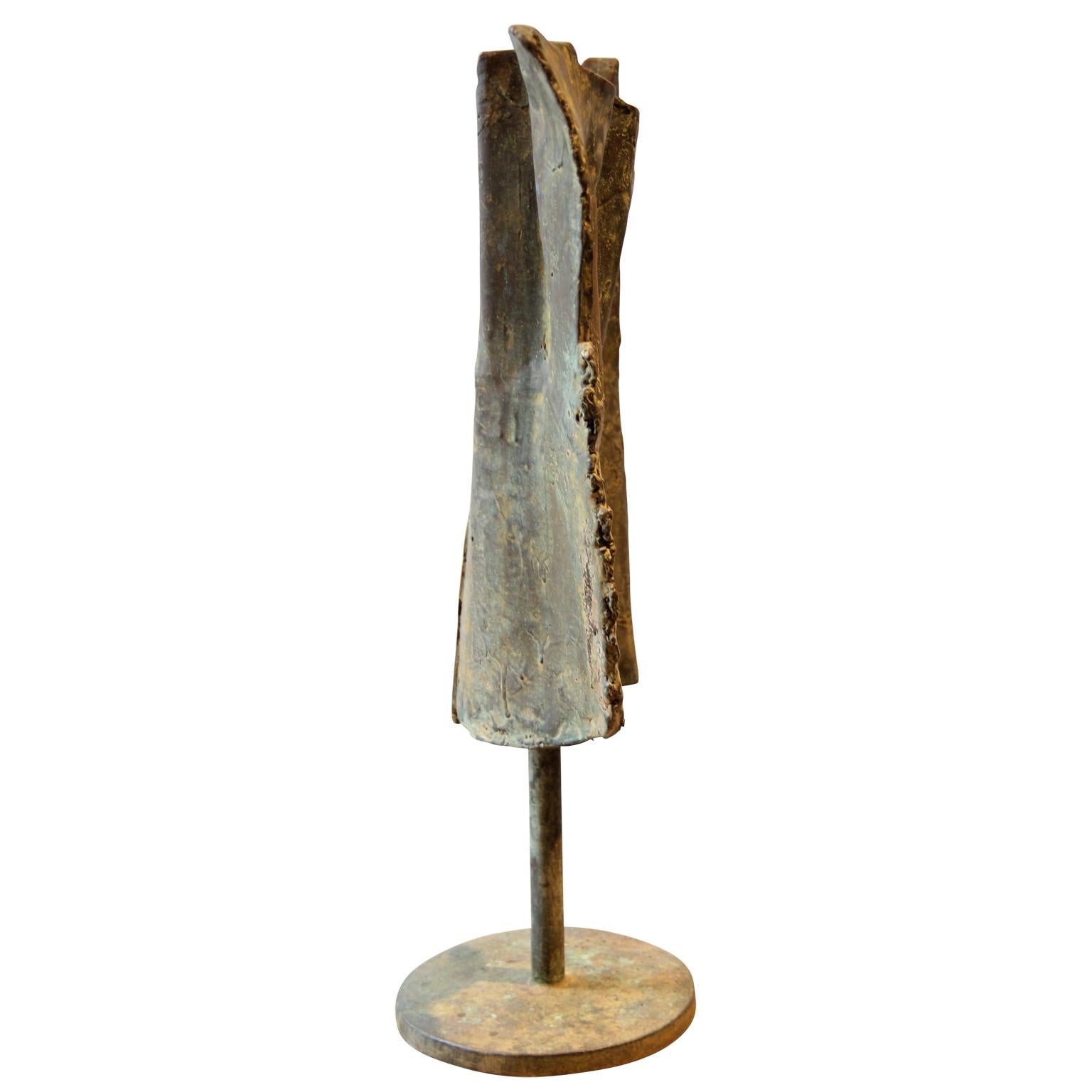Abstract bronze sculpture by W. R. Stevenson. The unique Brutalist sculpture stands on top of a round base that is signed by the artist. 

Artist Biography: William Robert Stevenson was born in 20 May 1925 in Eugene, Oregon. His family moved to