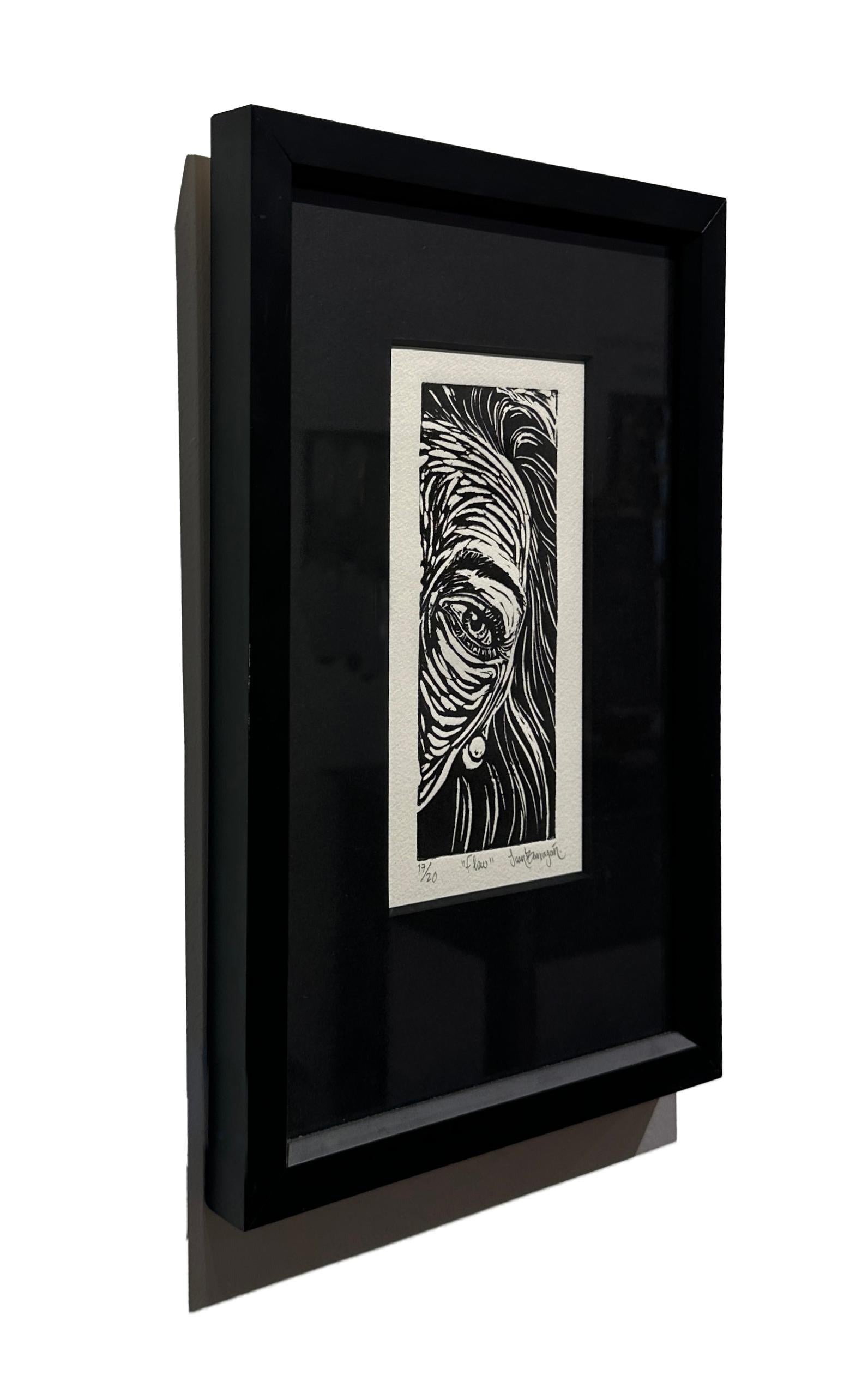 A woman tilts her head towards the viewer, one eye peaking around the edge of the frame in this small etching by Juan Barragán.  It is enhanced by the black mat and black frame.  This piece is edition 17 of a total of 20.

Juan Barragán
Flow
ink on