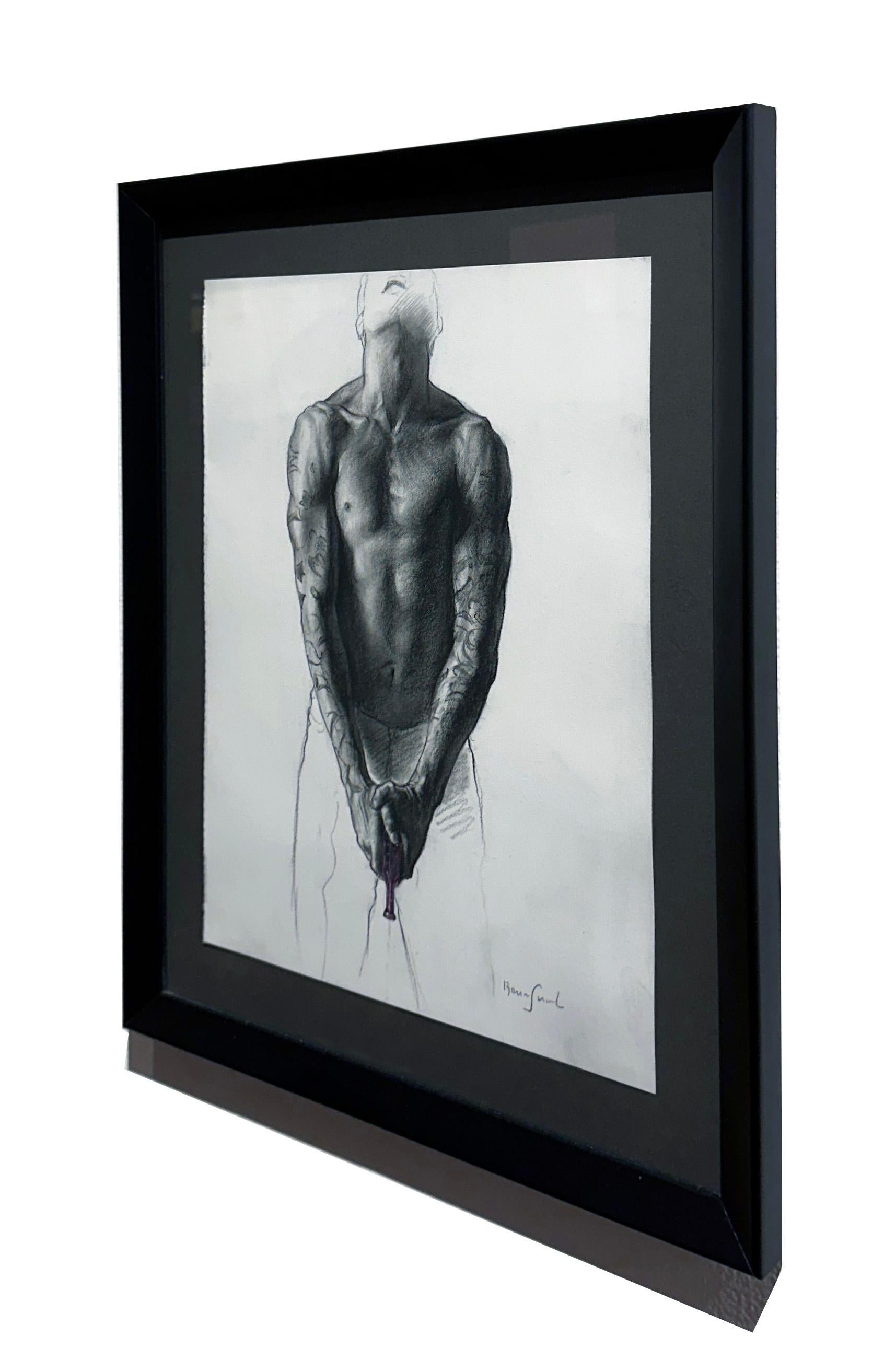 A muscular male torso with tattooed arms, holds a gun while gazing up towards the sky.  The face is obscured but the viewer is drawn toward the taut, defined muscles.  This piece is floated and framed in a simple black frame measuring 18.25h x