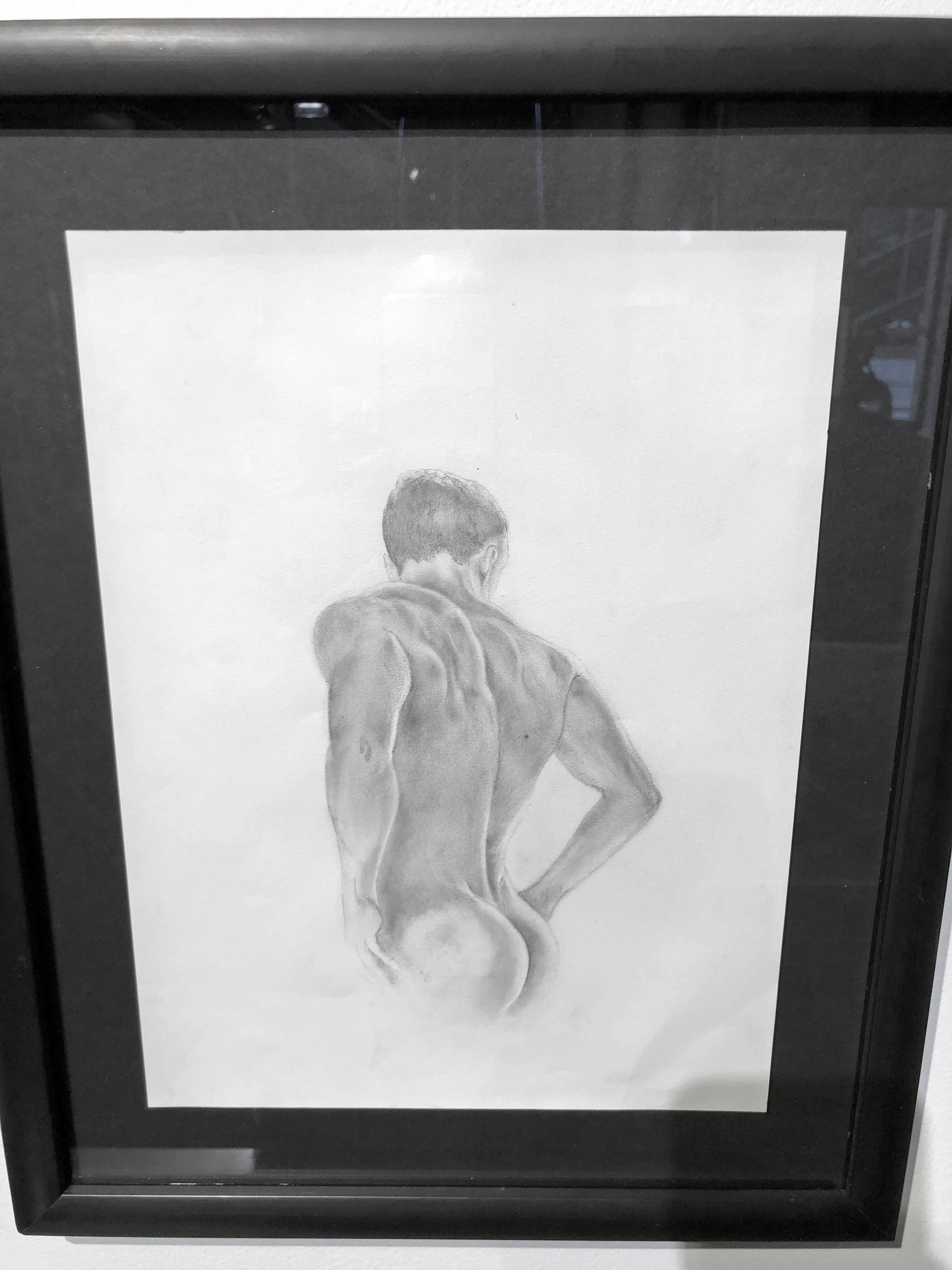 Rick Sindt's knowledge of the male physique is evident in this exquisite drawing of a nude male.  The subject, with his back to us,  stands with his hands on his hips gazing down at something unknown.  We are only privy to the beautifully muscled