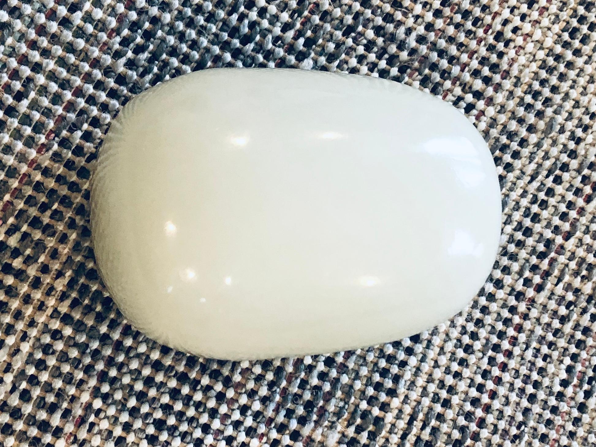 This is an antique Chines White Jade stone that has two small holes in the top where you can fit a cord. Chinese people often carry such an energy stone in their pocket and take it wherever they go. The most beautiful ones are made out of clear