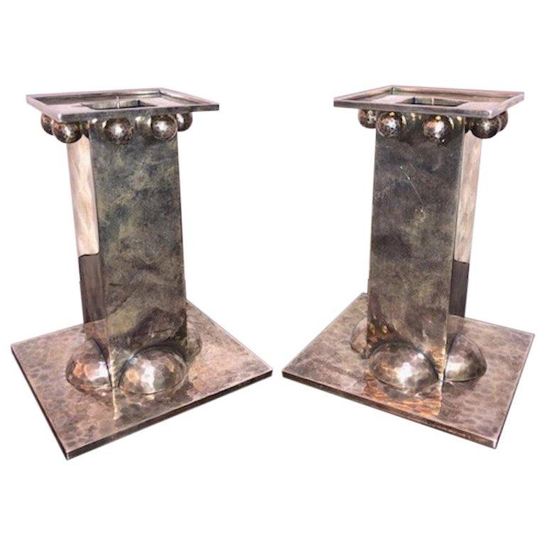 Silver plated French Candle   Holders done by Jean Despres
Jean Eugene Gilbert Despres  (1889-1980) was born in Avallon, a small town in Burgundy, where his parents had a small shop selling jewelry and gifts. At the age of 16, he went to Paris to