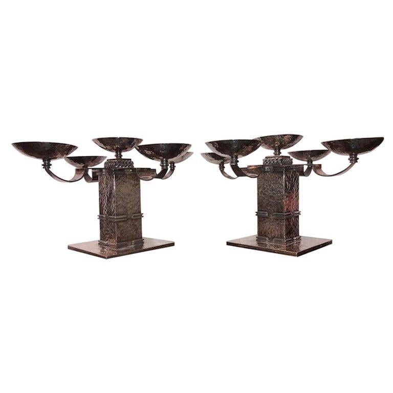 Pair of Candle Holders done by Jean Despres
Jean Eugene Gilbert Despres  (1889-1980) was born in Avallon, a small town in Burgundy, where his parents had a small shop selling jewelry and gifts. At the age of 16, he went to Paris to apprentice with a