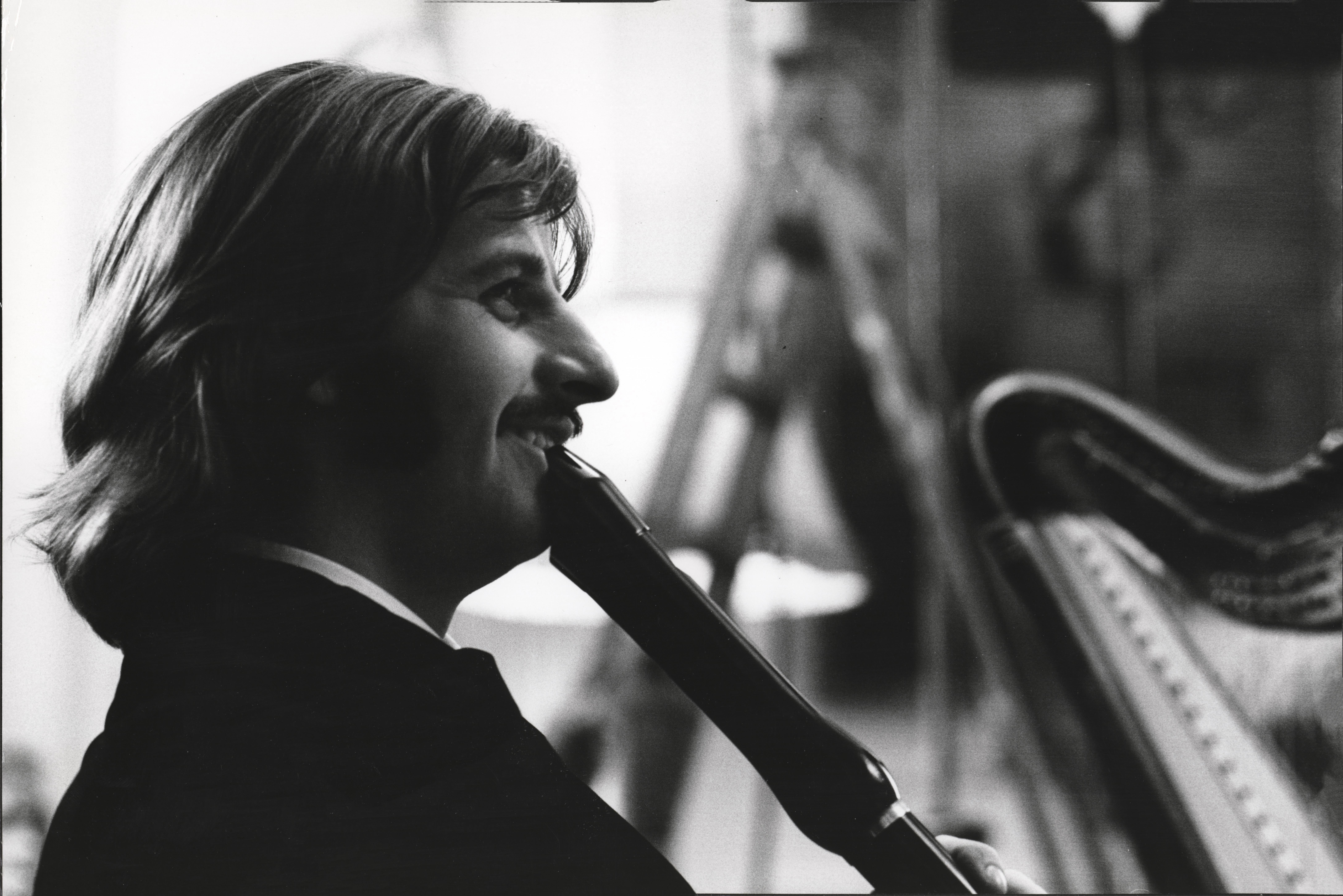 Bruce McBroom Black and White Photograph - Ringo Starr Smiling with Clarinet Fine Art Print
