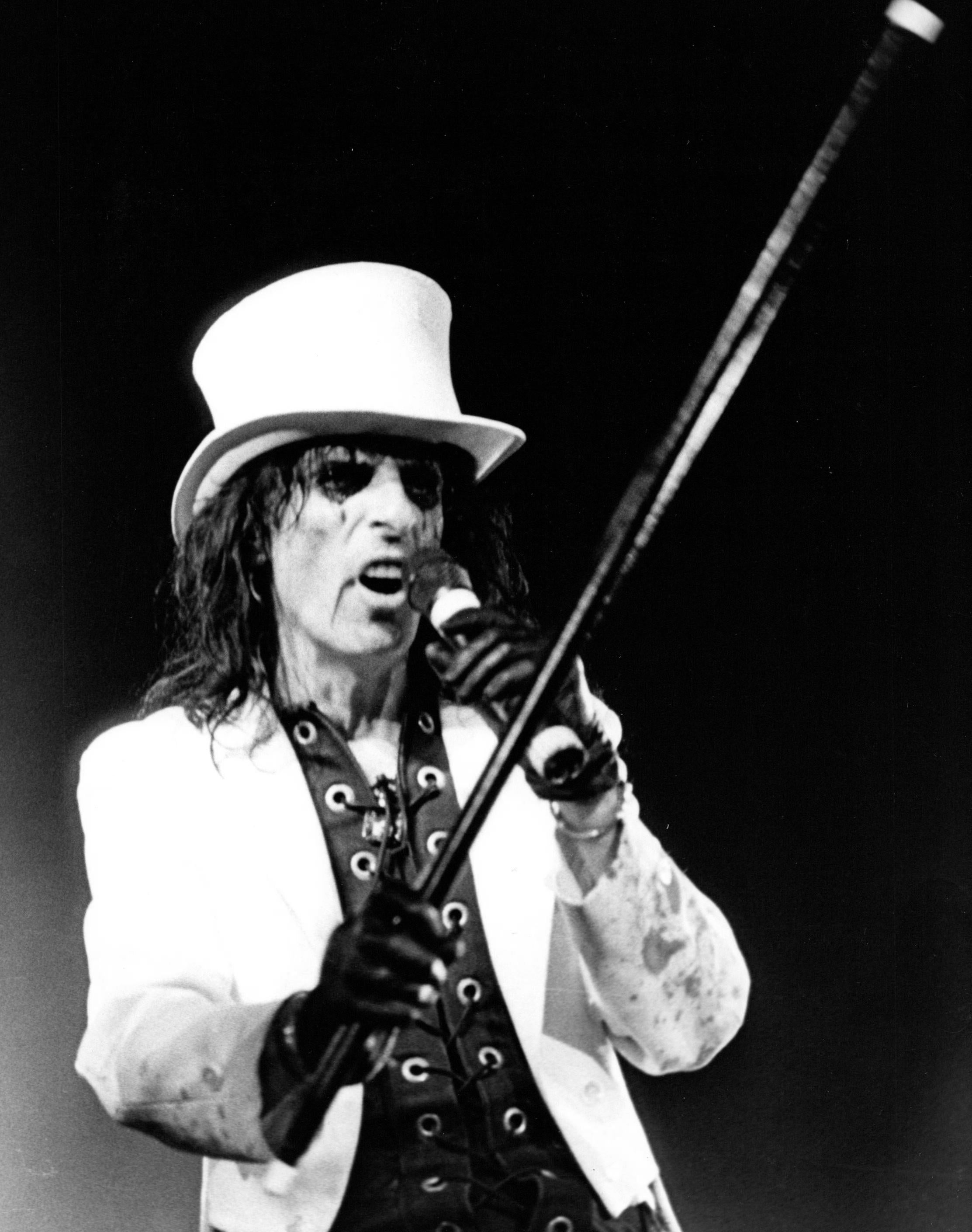 Christopher Helton Portrait Photograph - Alice Cooper Performing with Cane and Tophat Vintage Original Photograph