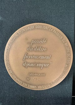 "De Draeger" bronze medallion with book