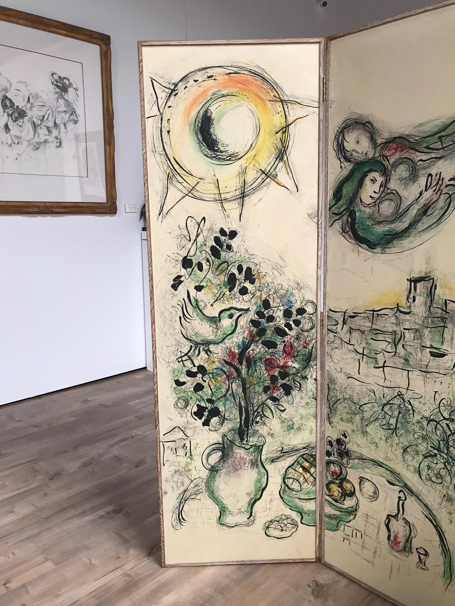 This piece is an original lithograph on four panels of a folding screen in wax oak.  Chagall only created one folding screen, in an edition of 100, in his lifetime and was heavily involved in every aspect of it's construction from months of research