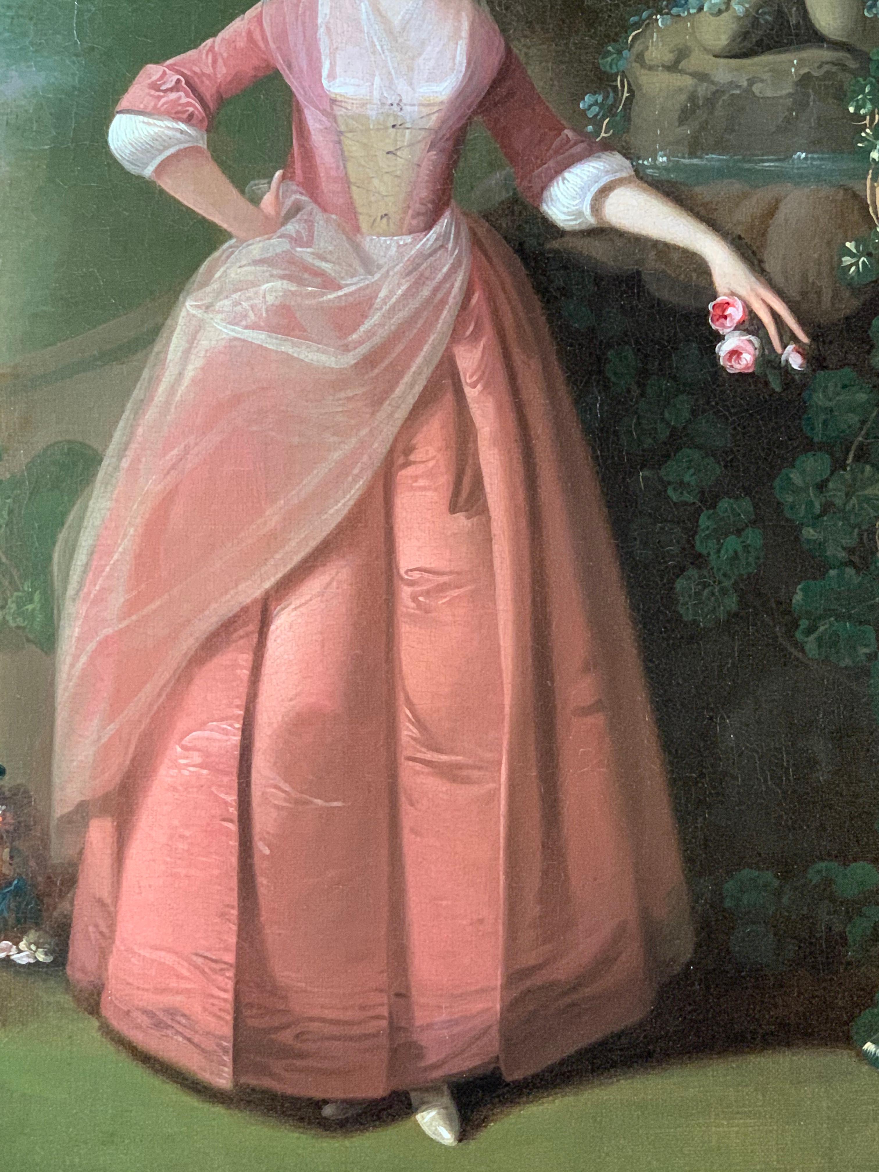 PORTRAIT OF MRS. BARRATT OF POTTLEY HALL WEARING A PINK DRESS IN A CLASSICAL GARDEN WITH A DOG AND AND A BASKET OF FLOWERS BESIDE HER.

Period Portraits are thrilled to offer this highly decorative 18th century English portrait of a lady gardener