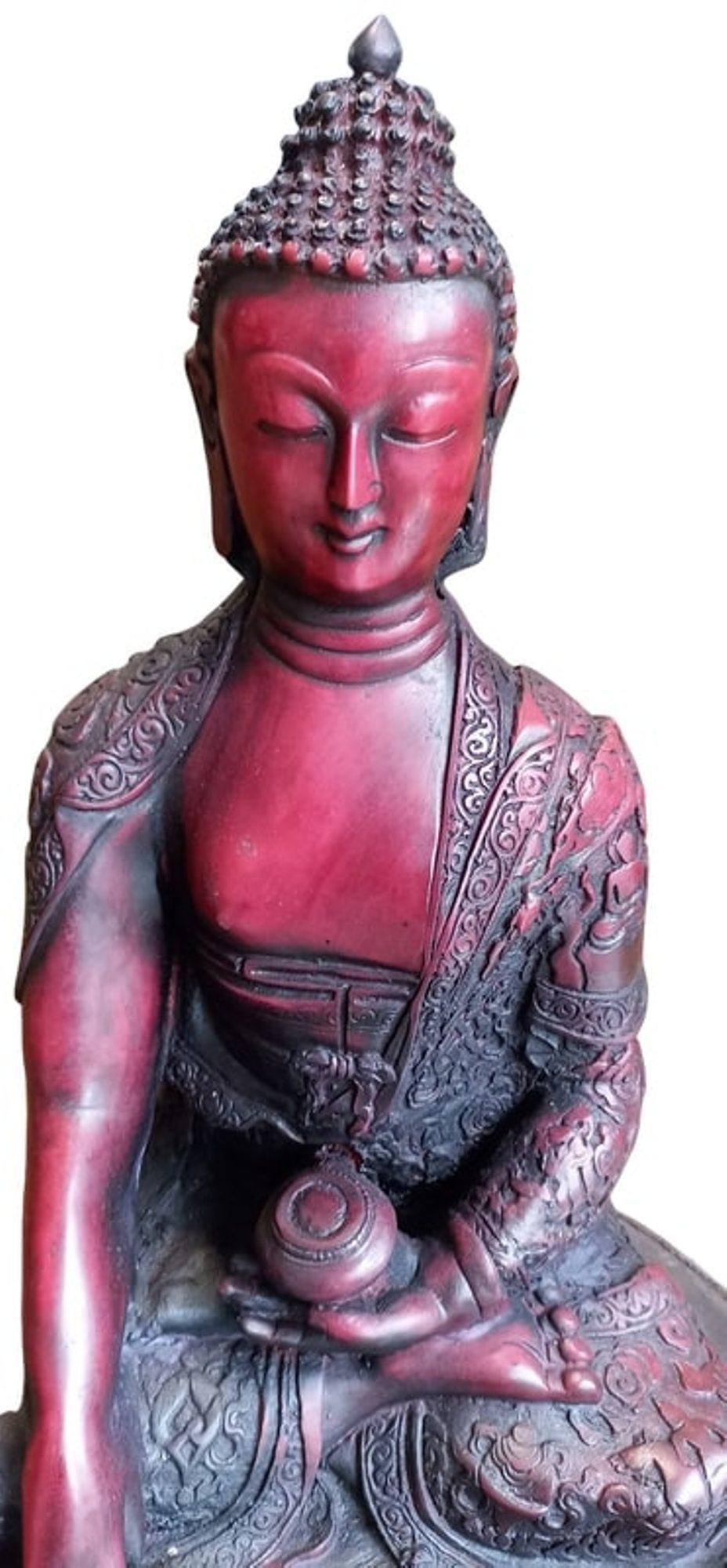red resin buddha statue