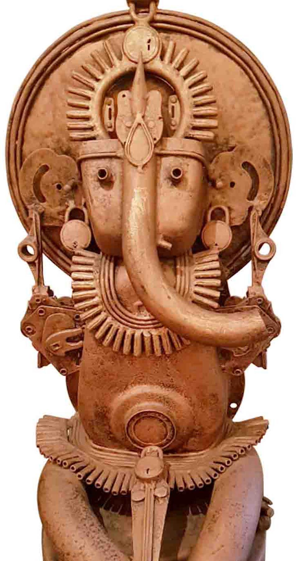 Narayan Sinha - Ganesha - 30 x 14 x 4 inches
Brass, Iron, Metal and Found Objects.

The artist uses discarded materials such as automobile parts, utensils, latches, locks, keys, wood, nuts and metal scrap to create sculptures and installations that